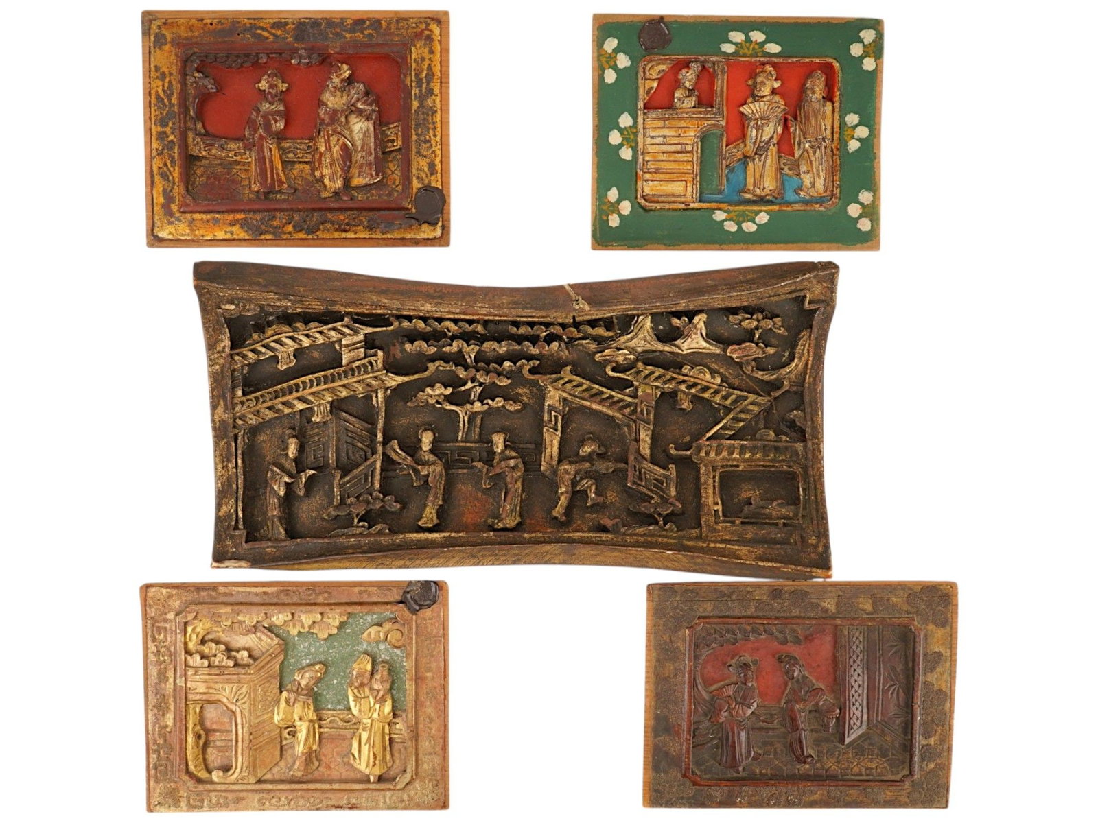 FIVE CHINESE DECORATIVE HAND PAINTED WALL PLAQUES: A lot of five Chinese decorative hand painted wall plaques. Each features a detailed high relief narrative scene depicting figures amidst architectural and natural elements. Chinese Wood Carving, Lacq