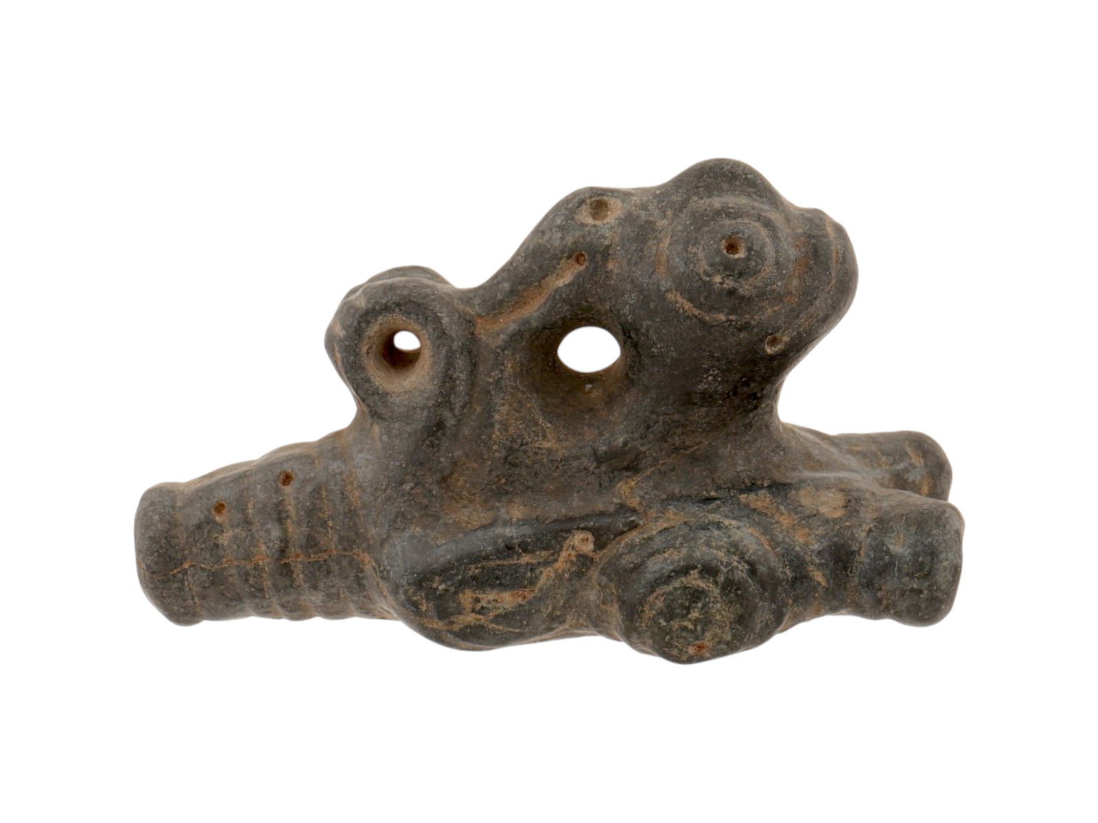 ANCIENT PRE COLUMBIAN TAINO ARAWAK STONE COHOBA INHALER: An ancient Pre Columbian Taino Arawak stone Cohoba Inhaler. The Inhaler features a fantastic bird-like creature with large eyes. There are holes on the head and on the bottom. The item is decorated wi