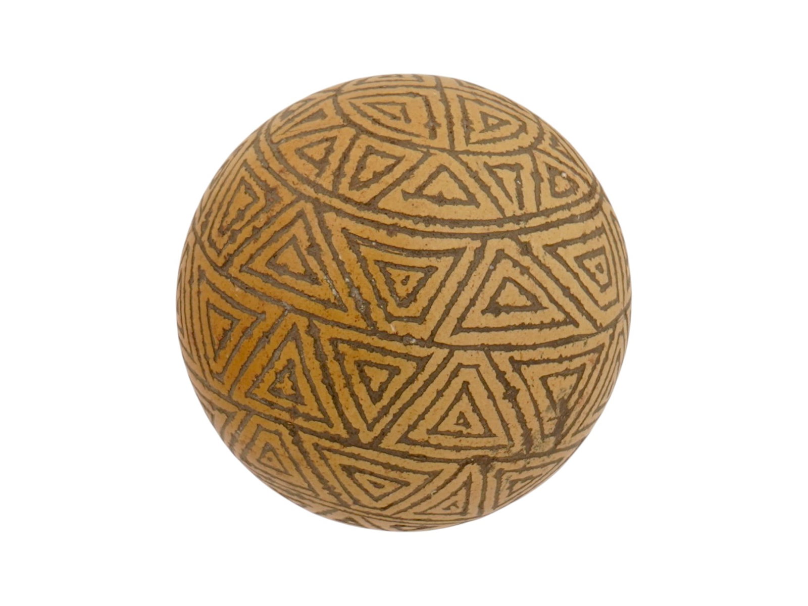 ANCIENT PRE COLUMBIAN TAINO CARVED STONE GAME BALL: An ancient Pre-Columbian Taino carved stone game ball. Used in the sacred ceremonial ball games central to Ta?no social and spiritual life. Fashioned from iron-rich stone and bears incised concentric 