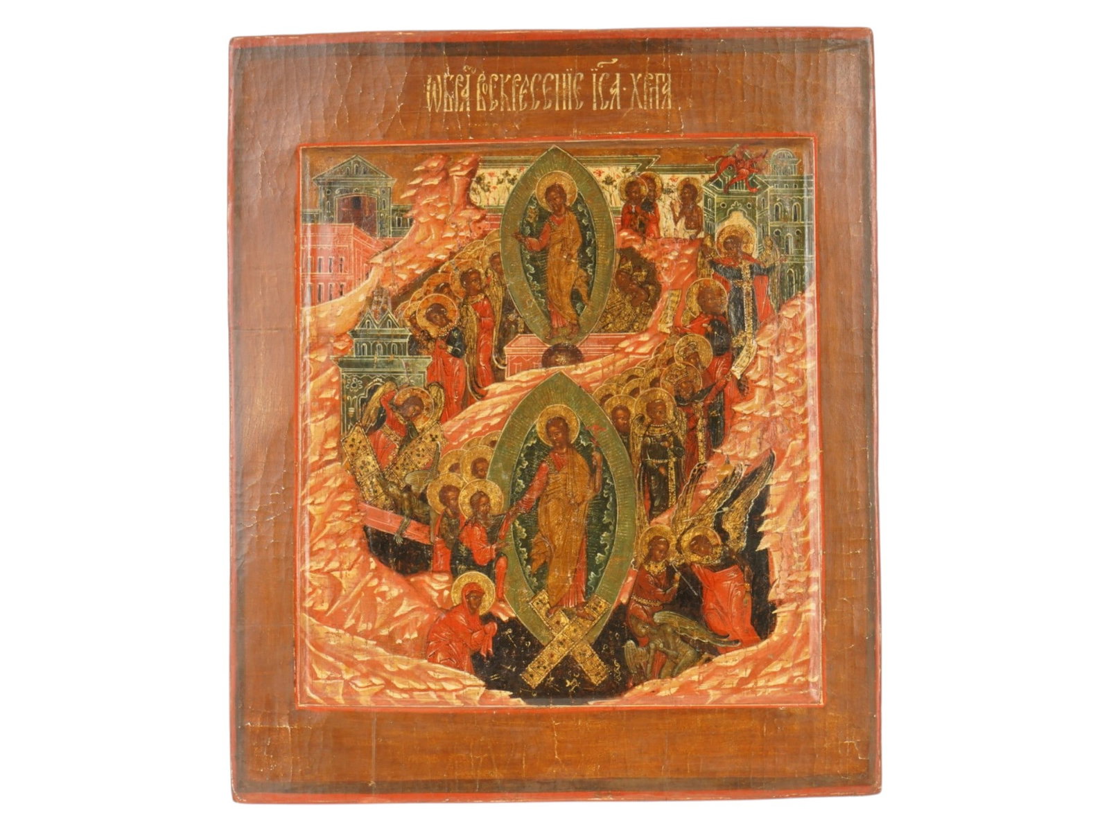 ANTIQUE 18TH C RUSSIAN ICON RESURRECTION OF JESUS: An antique 18th century Russian tempera on a gessoed wooden panel icon of the Resurrection of Christ and the Descent into Hell. Christ is depicted in a mandorla, standing upon the shattered gates of H