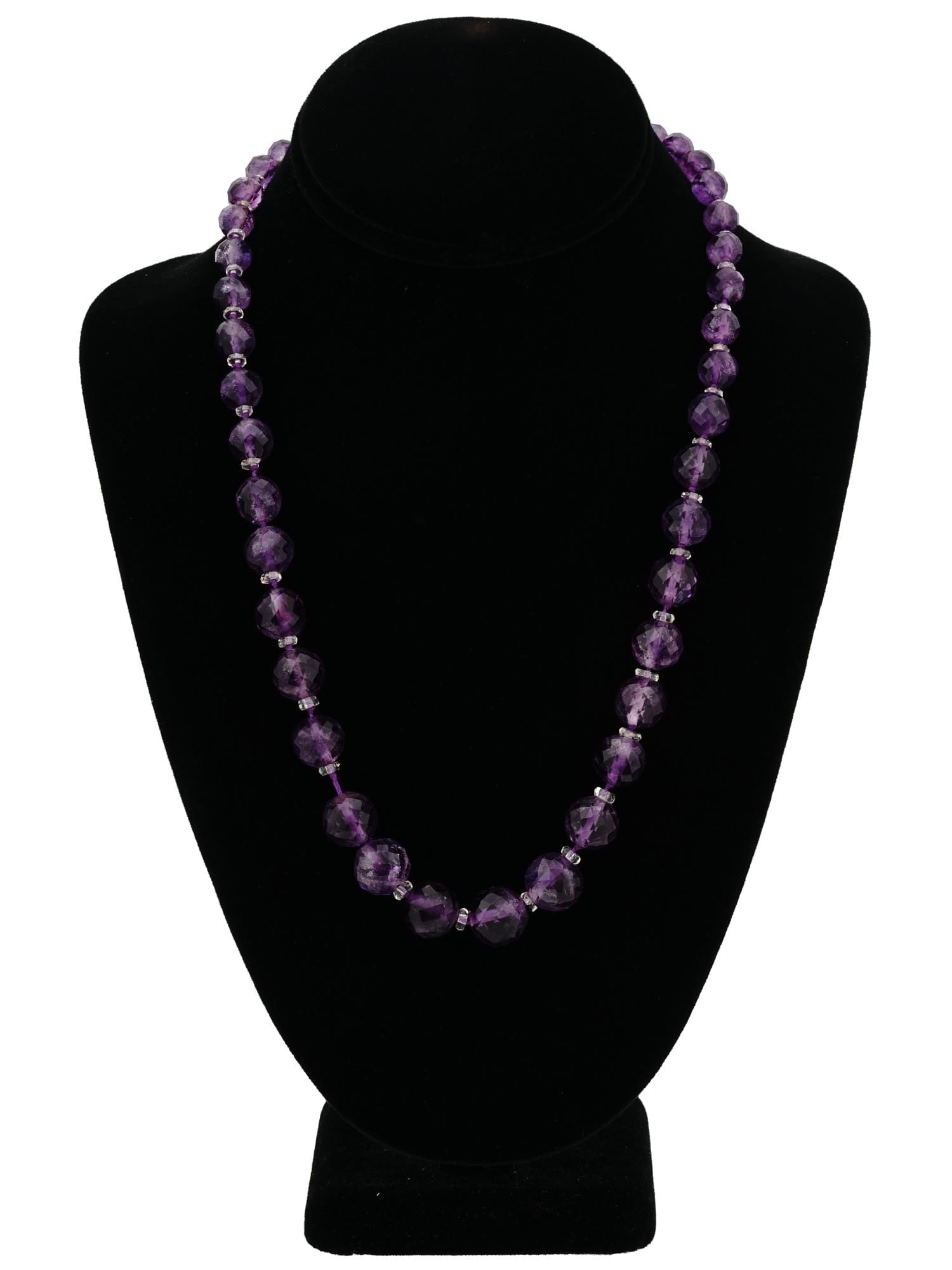HAND CARVED AMETHYST CRYSTAL BEADED KNOTTED NECKLACE: An antique necklace made for the Middle East Markets. The necklace is made in round shaped beaded and knotted designs and adorned with hand carved beads made from Amethyst stones and Crystal glass. An