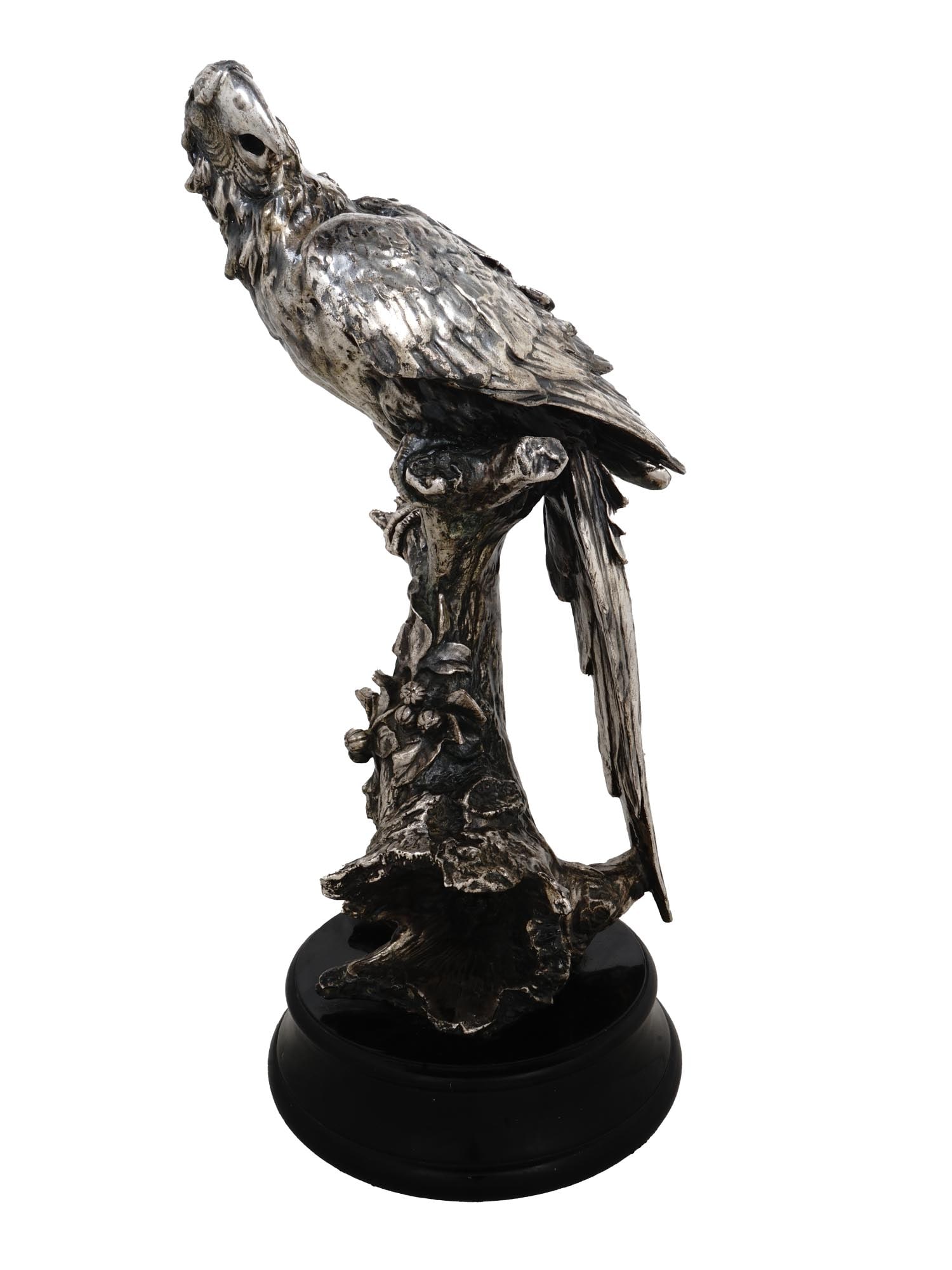 ANTIQUE SILVER PLATED CABINET FIGURE OF PARROT: An antique European silver plated cabinet figure. The figure is made in the shape of a parrot. The figure is adorned with engraved detailed patterns. Circa: 19th century. Mounted on a round shaped