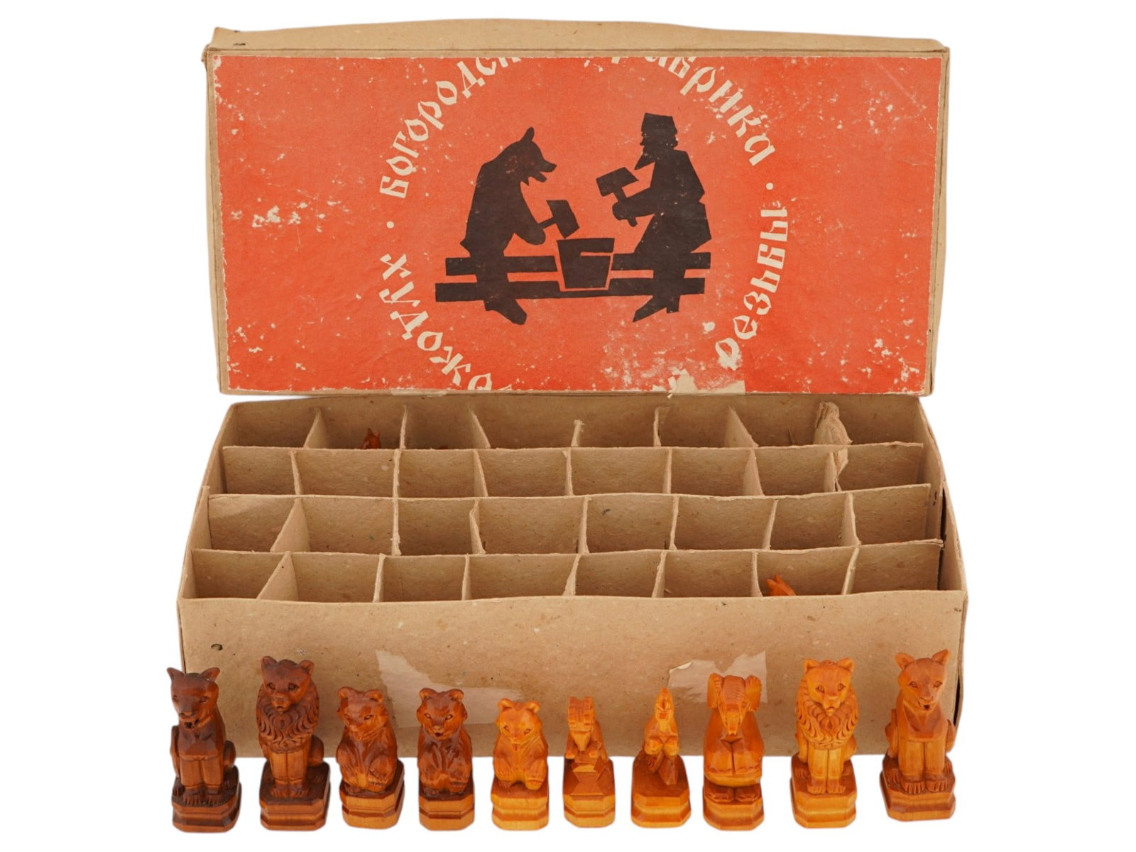 VINTAGE RUSSIAN SOVIET WOODEN CHESS FIGURES SET: A set of vintage Russian Soviet wooden chess figures issued by the Bogorodsk Art Carving Factory. A total of 32 items. The figures represent stylized animals, characteristic of the folk crafts of the 