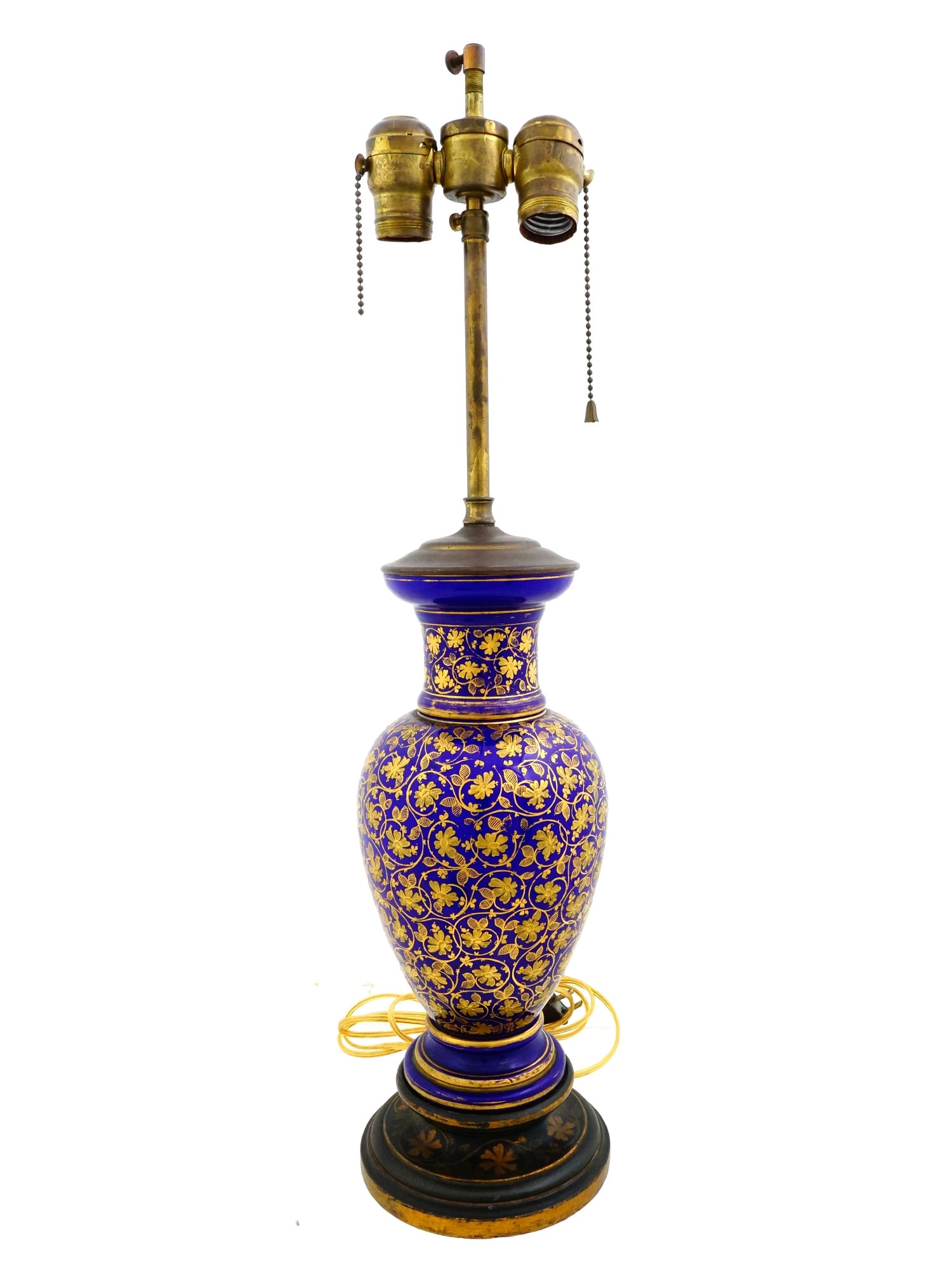 ANTIQUE BOHEMIAN BLUE OPALINE GLASS VASE LAMP: An early 20th-cenutry Bohemian cobalt blue opaline glass vase converted into a table lamp with electrical fittings. Classic baluster shape. Gold inlay leaf ornament. Mounted on a brass base. Two light