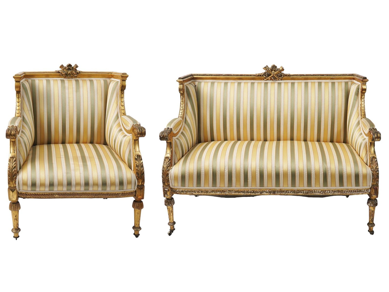 ANTIQUE RUSSIAN WOOD ARMCHAIR AND SOFA SET: A pair of antique Russian patinated wood armchair and a sofa. The chairs are adorned with bronze elements, hand-carved foliage and scrollwork patterns, a figural symbol in the shape of roses and torch