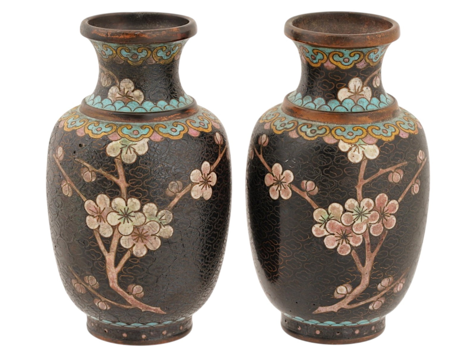 PAIR OF CHINESE POLYCHROME CLOISONNE ENAMEL VASES: A pair of Chinese enamel vases. Each vase has a globular shaped body with a wide neck and a fluted mouth. The exterior of the vases are covered with a polychrome design representing sakura tree branch