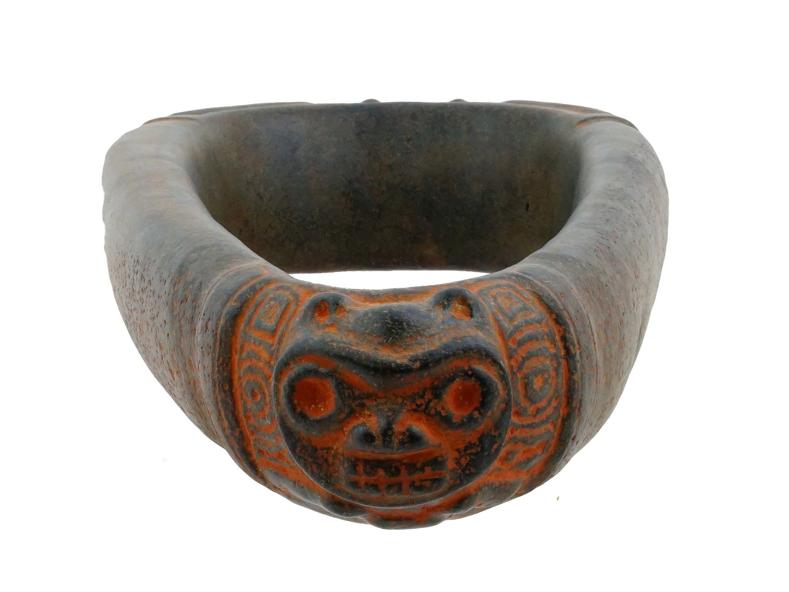 ANCIENT PRE COLUMBIAN TAINO STONE YOKE COLLAR: An ancient Pre-Columbian Taino hand carved hard stone elliptical collar, known as yoke. Taino culture. The ware is adorned with a zoomorphic figural design and engraved ornaments. Yoke served as regal