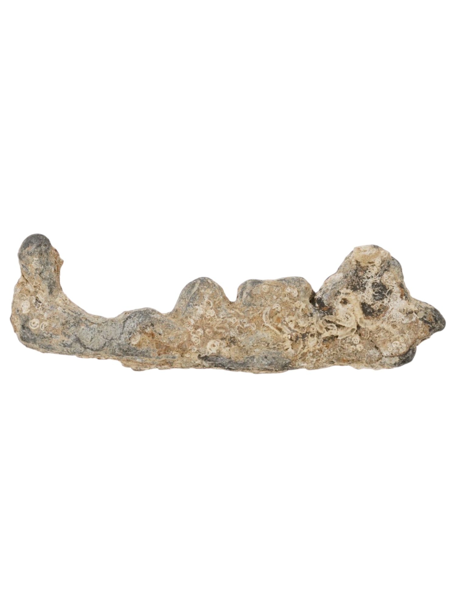 ANCIENT GREEK VOTIVE OR TOY LEAD SHIP FIGURINE: An ancient Greek votive or toy lead ship shaped figurine. Circa 500 to 300 BC. The elongated form suggests a galley or nautical vessel, likely intended as a religious votive offering for a maritime de