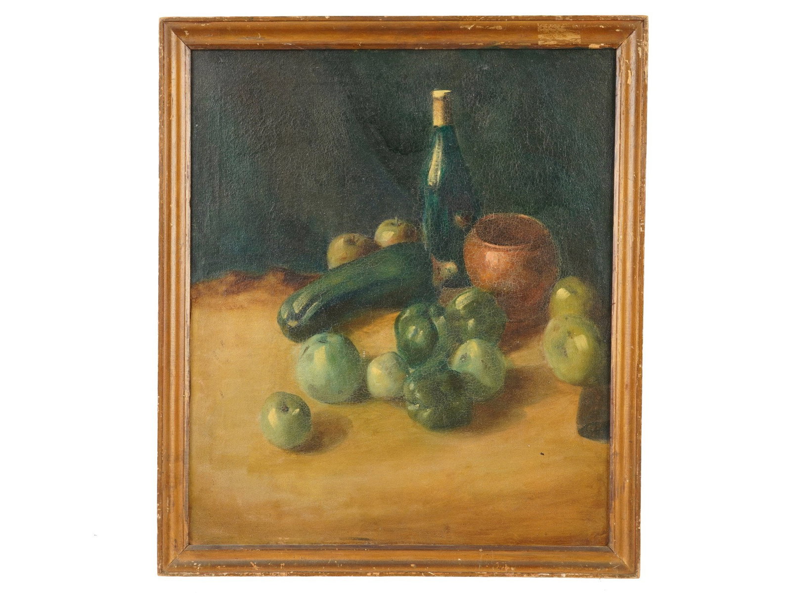 STILL LIFE OIL PAINTING WITH VEGETABLES AND BOTTLE: A still life oil on canvas painting, depicts an arrangement of harvest vegetables and fruits including a prominent zucchini, green peppers, and green apples alongside a tall green glass bottle and a r