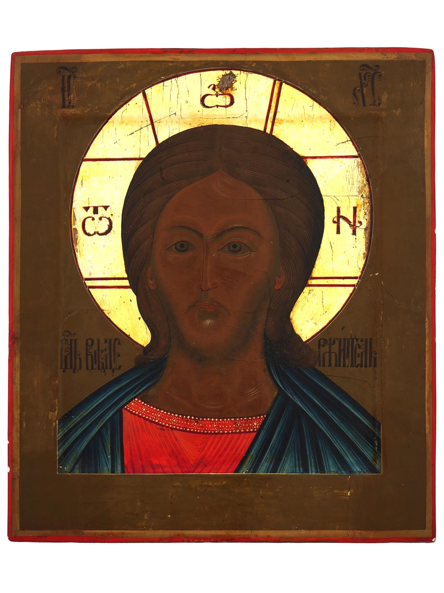 ANTIQUE 19TH C RUSSIAN ICON CHRIST THE FIERY EYE: An antique 19th-century Russian Orthodox icon representing Jesus in the Burning Eye iconography, a variation of the Lord Almighty type which only shows the shoulders and face of Christ. Mixed media