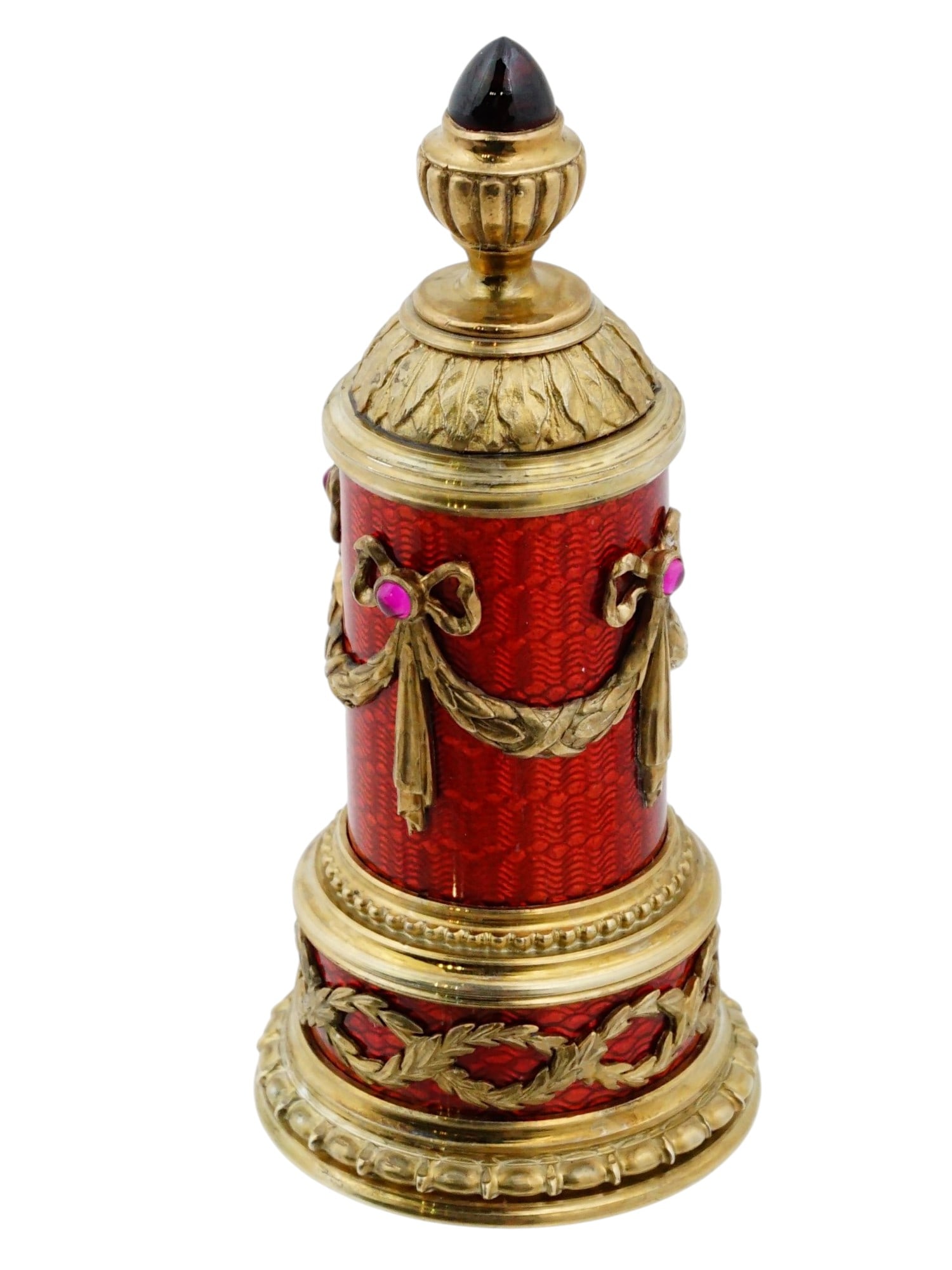 RUSSIAN 88 SILVER ENAMEL GARNET PERFUME BOTTLE: A Russian Silver perfume bottle. The ware is constructed from 88 silver gilt and features translucent red guilloche enamel over an engine turned ground. The cylindrical body is decorated with applied