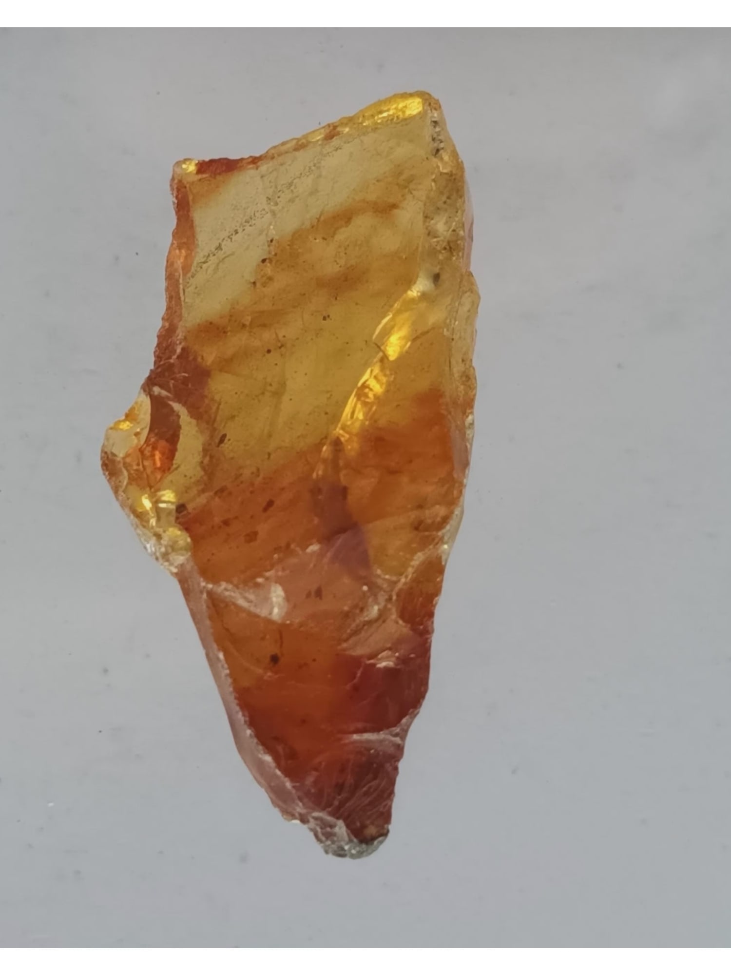 ROUGH BURMITE AMBER: Yellow to orange transparent rough burmite amber with small inclusions. Weight: 3.4 grams. Origin: Hukawng valley, Kachin state, Myanmar. (ABR8/44) THIS LOT QUALIFIES FOR A 30-DAY UNCONDITIONAL