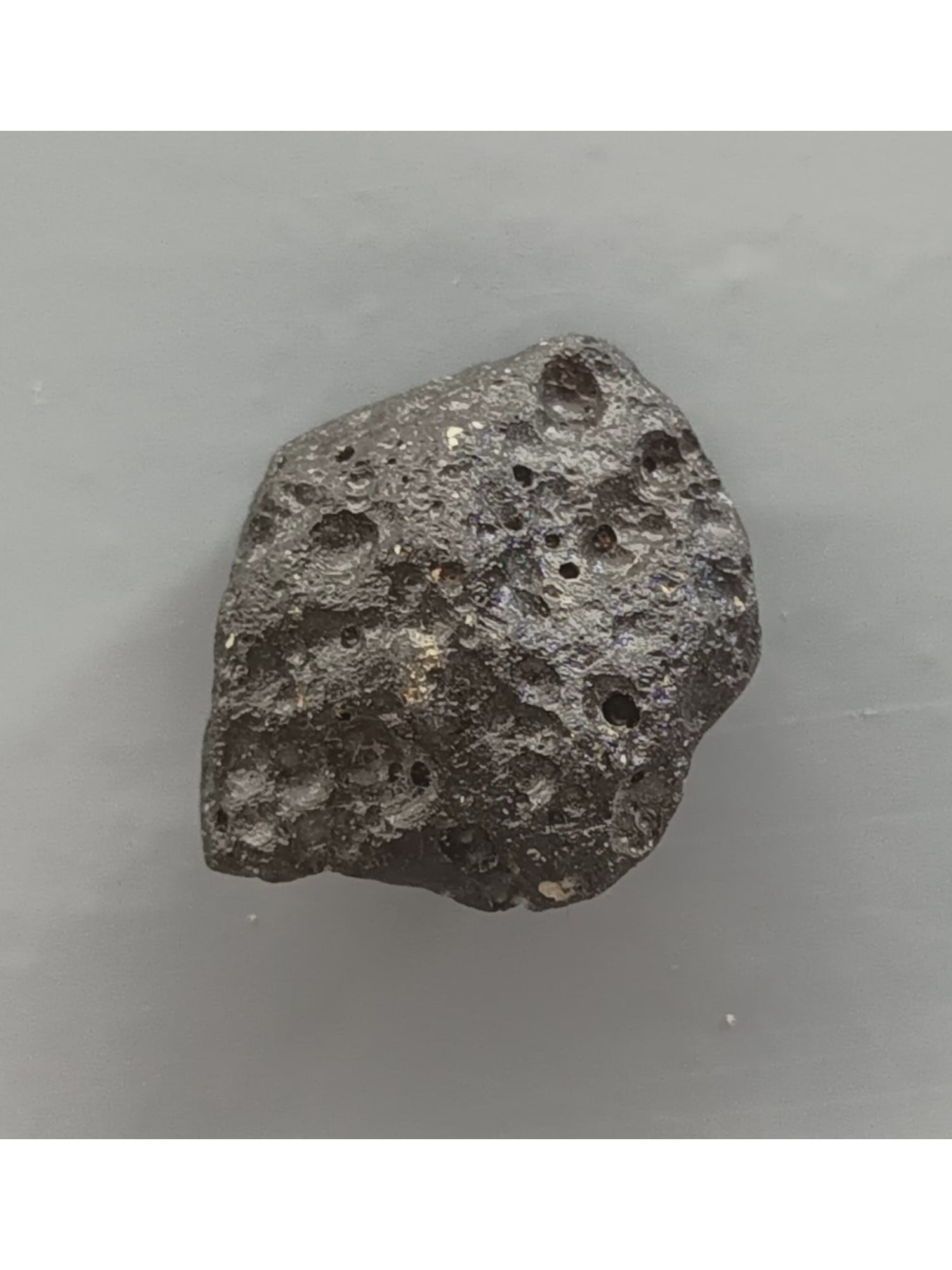 TEKTITE - FROM METEORITE IMPACT: Glossy philippinite tektite with varied deep pits. Perfect. Weight: 9 grams. Origin: Paracale, Camarines Norte, Luzon, Philippines. (TE8/104) THIS LOT QUALIFIES FOR A 30-DAY UNCONDITIONAL RETURN FROM