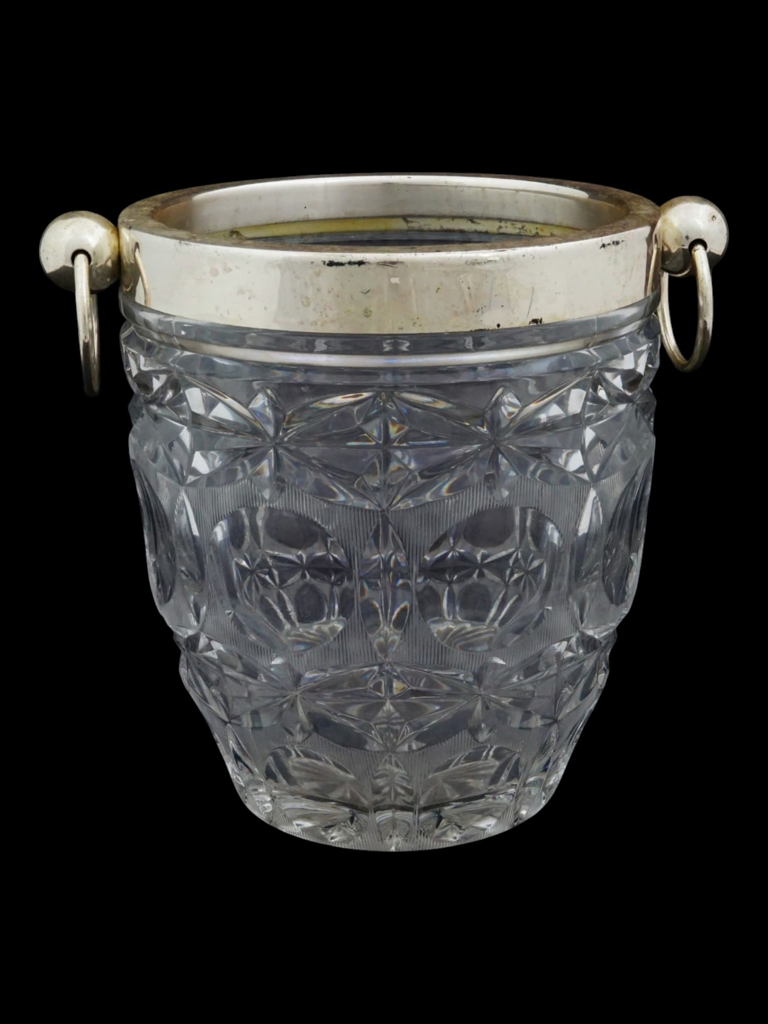 VINTAGE MID 20TH C EUROPEAN CRYSTAL ICE BUCKET: A vintage, mid 20th century, European crystal ice bucket. The bucket features a classic shape and slightly flares at the top. The top rim and ring handles are made of metal, possibly silver plated. Ta