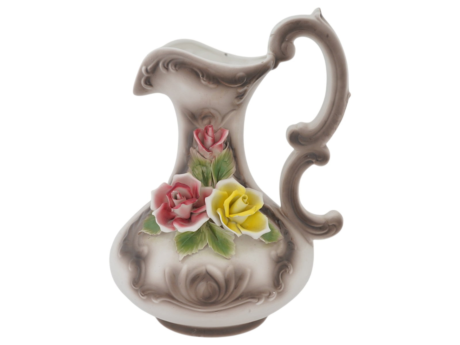 VINTAGE ITALIAN CAPODIMONTE PAINTED CERAMIC PITCHER: A vintage Italian Capodimonte painted ceramic pitcher. The pitcher has a strongly curved shape with a figured handle in the form of a double curl. It is decorated with relief sculptural roses of red
