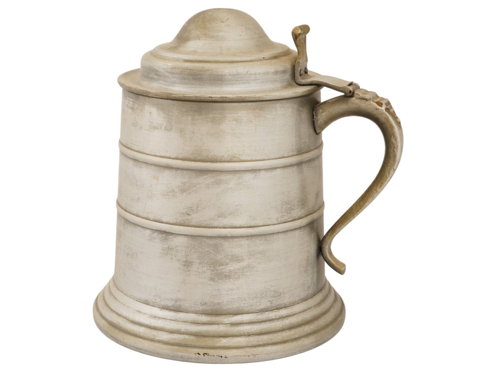 VINTAGE MEATL BEER STEIN: A vintage meatl beer stein. It features a tall, slightly conical body with several horizontal molded lines for decoration and reinforcement. It has a robust, curved handle and a hinged domed lid with