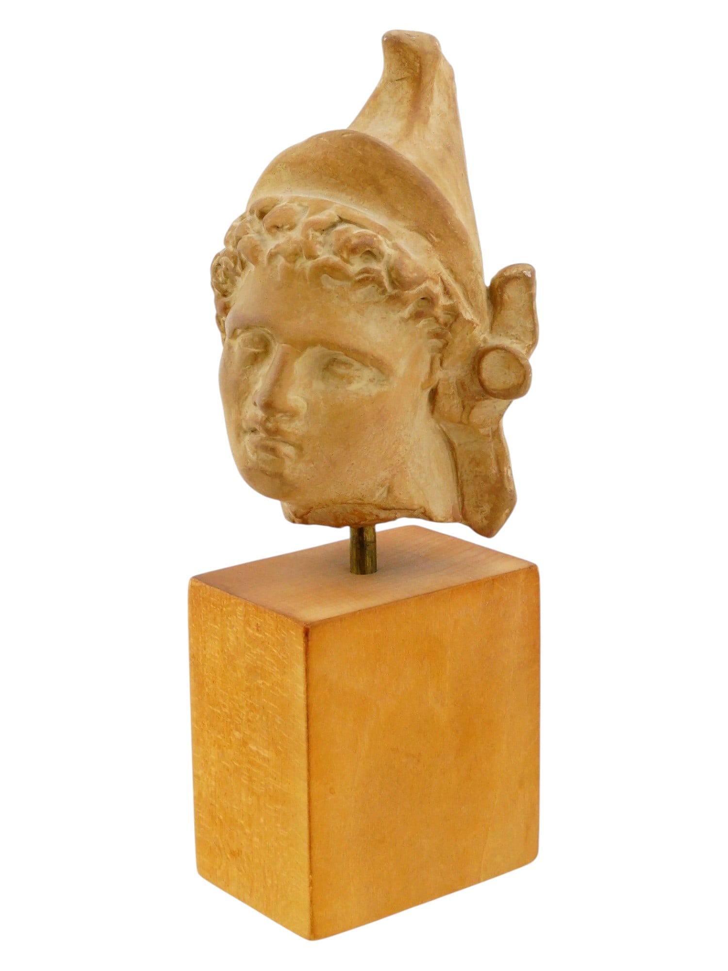 SCULPTURAL BUST YOUTHFUL FIGURE WITH CLASSICAL FEATURES: A Grand Tour sculptural bust depicting a youthful figure with idealized classical features presented as an archaeological fragment. The subject is shown wearing a Phrygian cap, a form of headwear asso