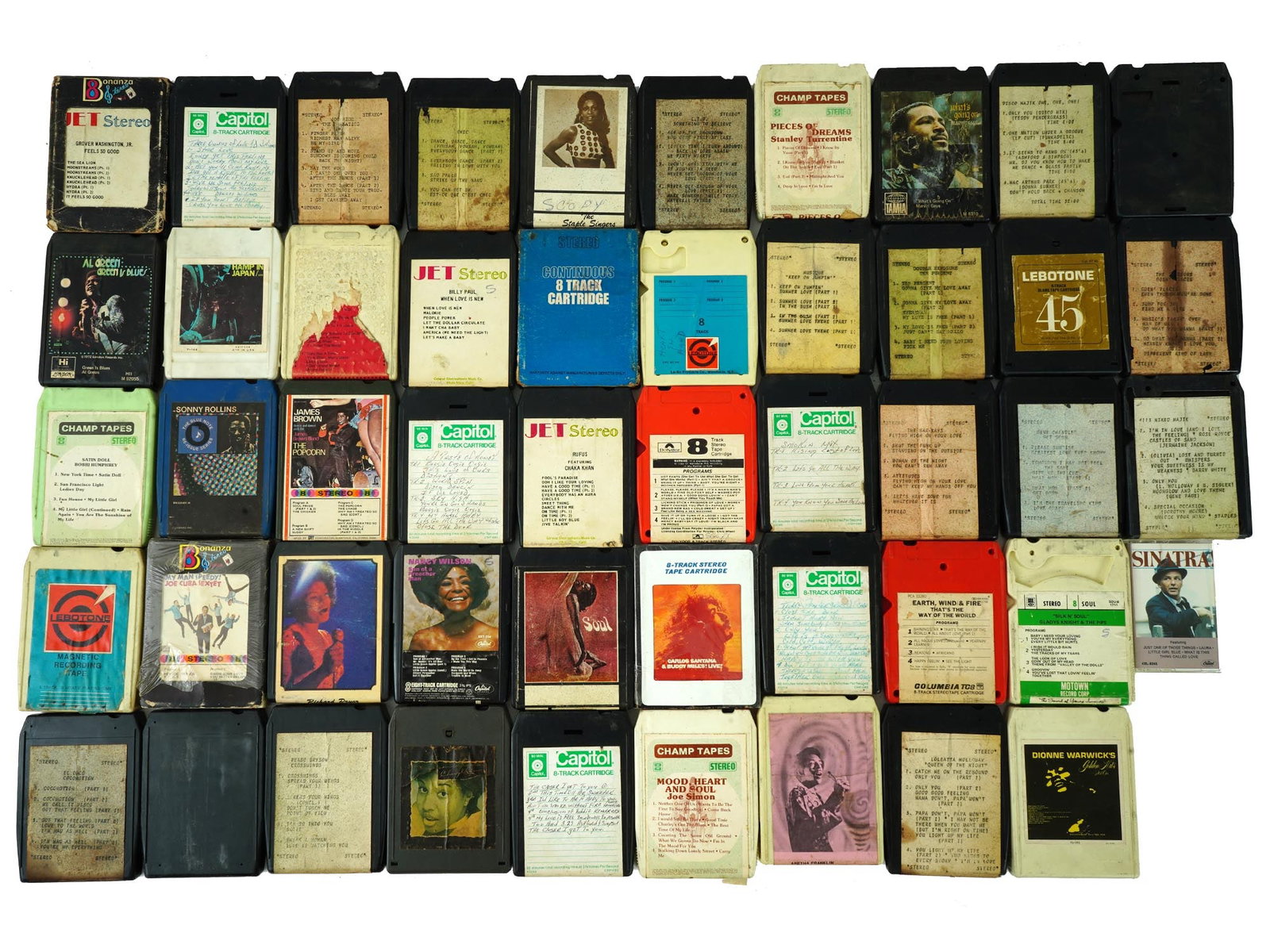 VINTAGE 8 TRACK STEREO TAPE CARTRIDGES AUDIO CASSETTES: A collection of mixed vintage 8-track stereo tape cartridges and audio cassettes from the 1970s and 1980s. These classic formats capture the music and audio styles of the time, offering a nostalgic