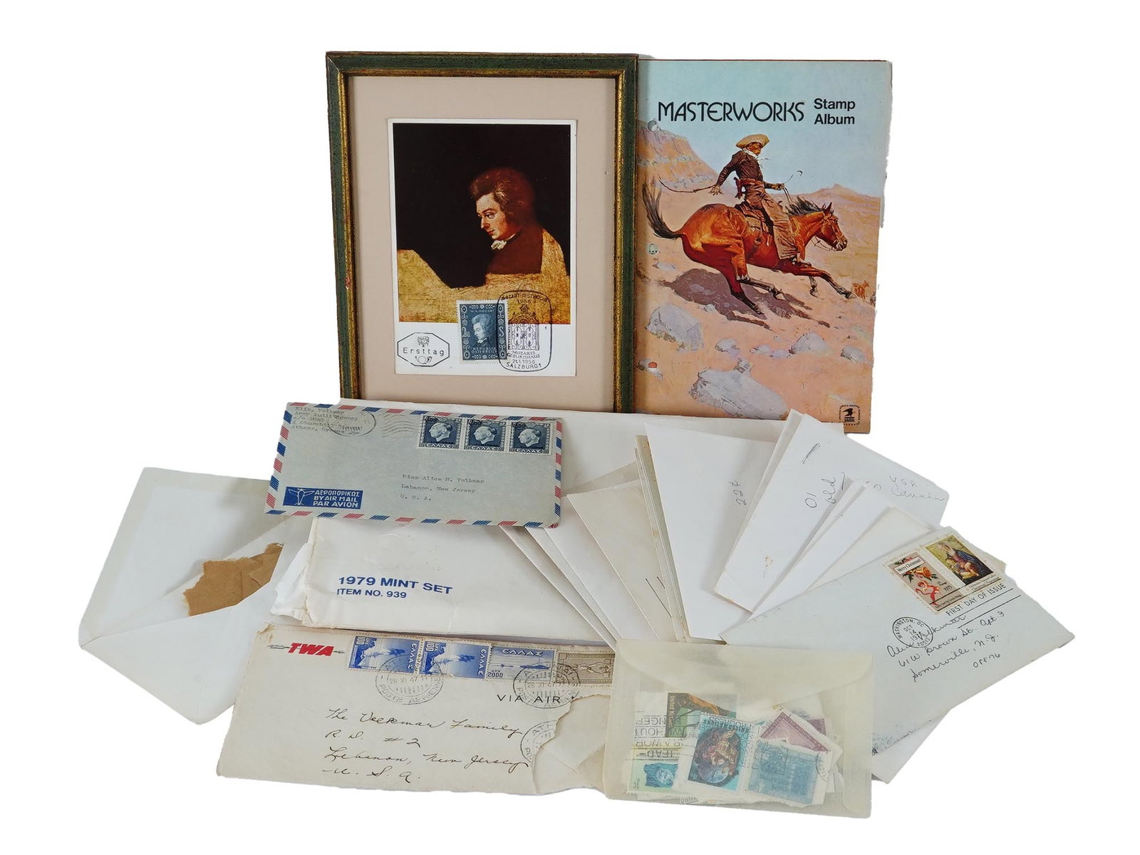 VINTAGE STAMPS 1956 MOZART STAMP AND MASTERWORKS ALBUM: A collection of various vintage international stamps from different periods, including a notable 1956 Mozart stamp issued in Salzburg on the occasion of his bicentenary, framed together with a
