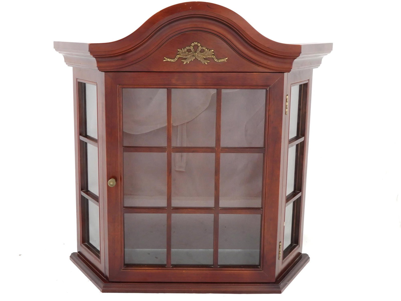 VINTAGE BOMBAY COMPANY HANGING CURIO CABINET: A vintage wall curio cabinet by Bombay Company. Made in China, 1996, model no. 02 HKB. Chippendale style. Hardwood display case with framed glass door and sides. Gilt overlay ribbon on top. Bombay