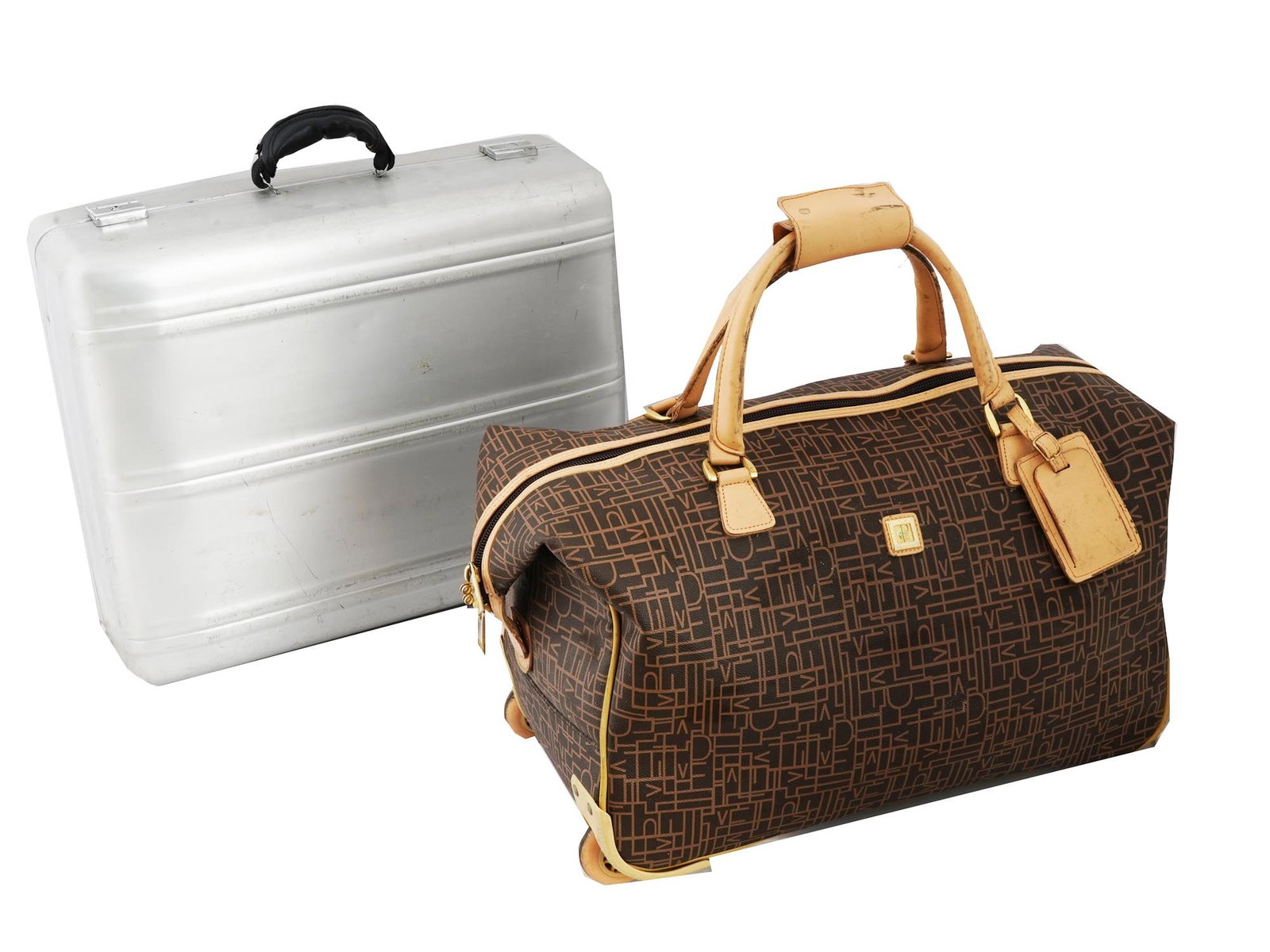 METAL SUITCASE AND DIANE VON FURSTENBERG DUFFEL BAG: A lot of two travel bags. A silver tone hard shell suitcase: This is a classic, rectangular suitcase made of durable metal. It has a black handle and looks fairly large, likely suitable for a longer