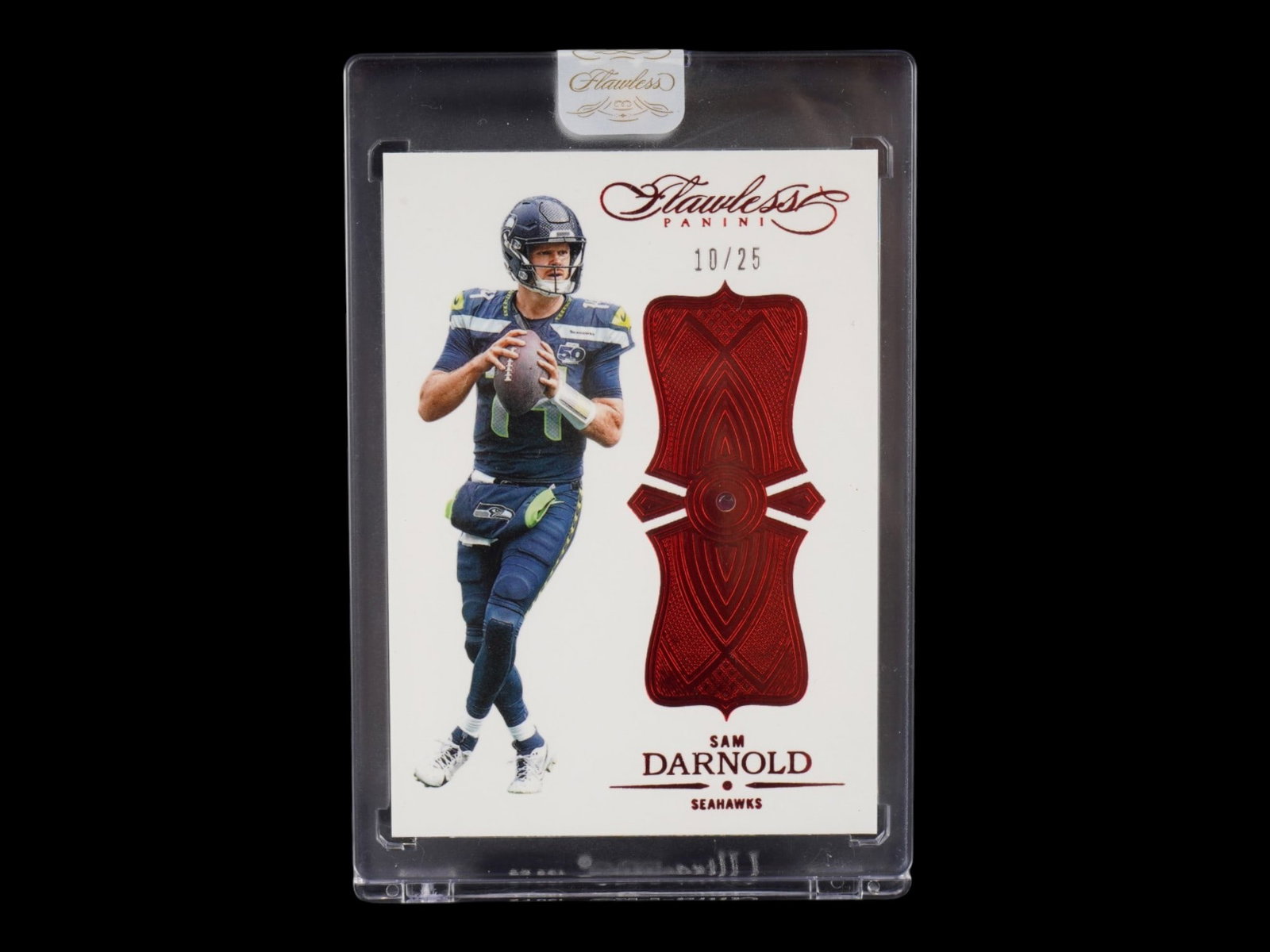 2025 FLAWLESS SAM DARNOLD RUBY GEMSTONE /25: This elite 2025 Panini Flawless card features Seattle Seahawks quarterback Sam Darnold in the prestigious Ruby parallel, strictly limited to only 25 copies worldwide. A hallmark of the Flawless