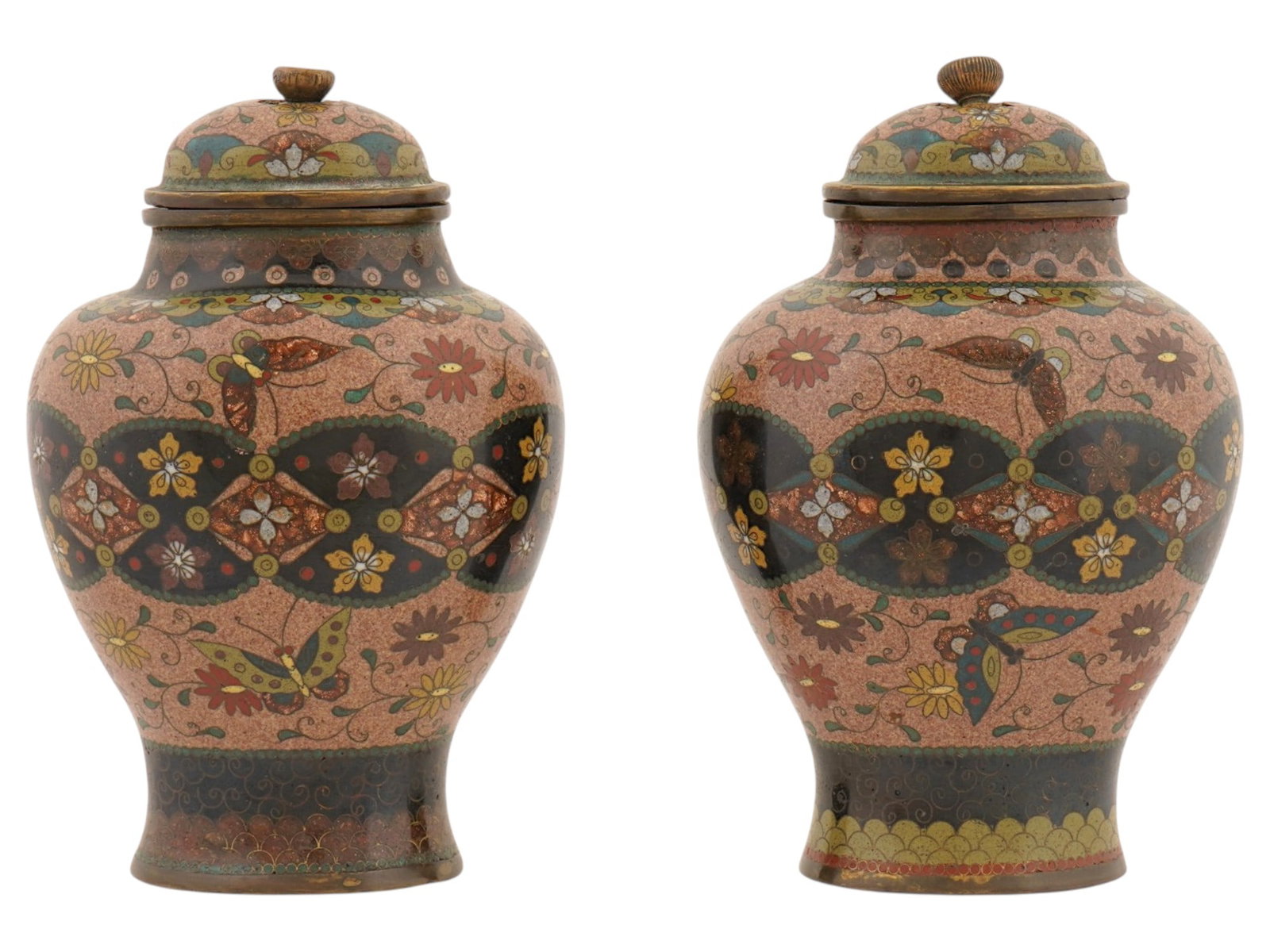 PAIR OF JAPANESE MEIJI COVERED CLOISONNE ENAMEL JARS: A pair of antique Japanese Meiji era covered enamel jars. The surface of the vessels are decorated with a complex multicolored pattern depicting multicolored butterflies, chrysanthemum flowers, and tr