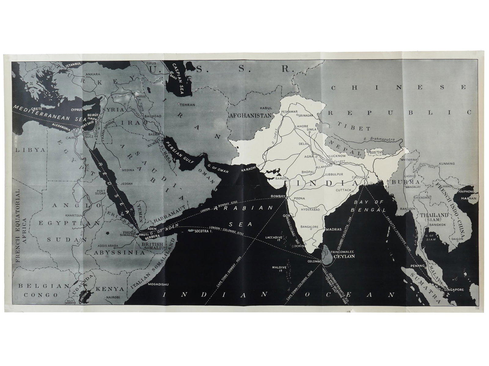 VINTAGE BRITISH POSTER MAP OF THE INDIAN OCEAN REGION: A vintage British poster featuring a map of the Indian Ocean region, with India at the center. The map highlights the countries and regions surrounding the Indian Ocean. The poster is stamped on the