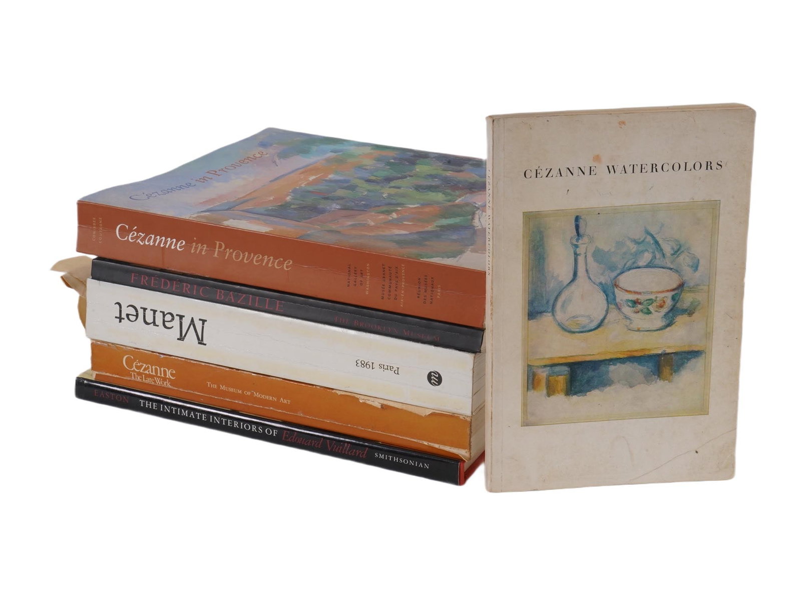 SIX IMPRESSIONIST ILLUSTRATED BOOKS AND CATALOGS: A lot of six impressionist illustrated books and catalogs in English. The lot contains an album Cezanne in Provence. A book The Intimate Interiors of Edouard Vuillard, published by The Museum of Fine 
