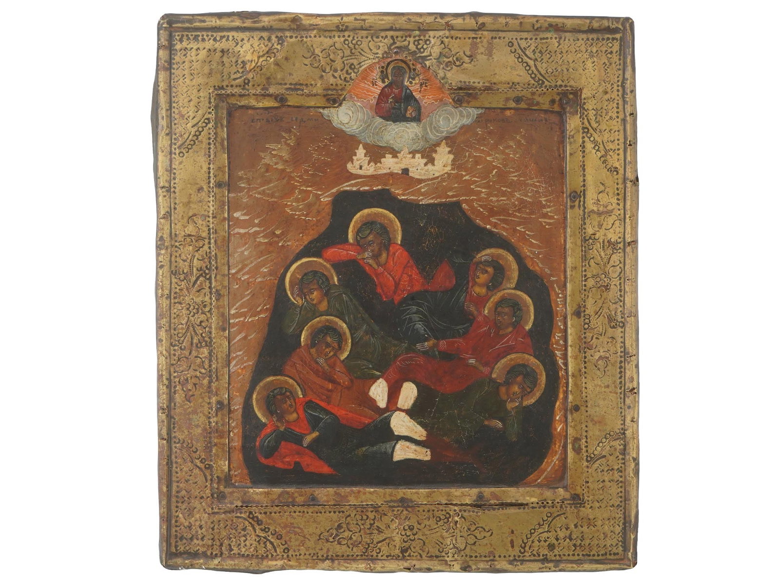 ANTIQUE RUSSIAN ORTHODOX ICON OF SEVEN SLEEPERS: An antique Russian Orthodox icon of the Seven Sleepers of Ephesus. Mixed media painting: egg tempera, gesso, and levkas on a wood board, gilt background and gilt chased metal framing. The medieval leg