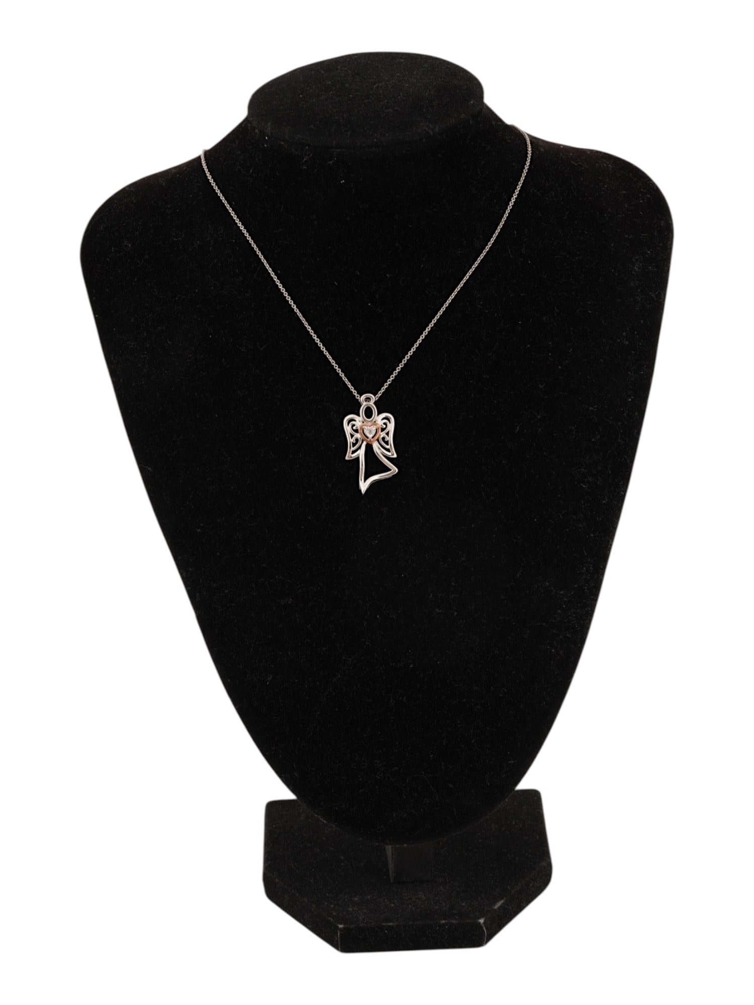 VINTAGE STERLING SILVER DIAMOND ANGEL PENDANT: A vintage sterling silver cable chain necklace with a pierced angel pendant set with a natural heart-shaped diamond. Marked 925, Italy on the clasp. Total Weight: 4.4 g. Vintage Jewelry And
