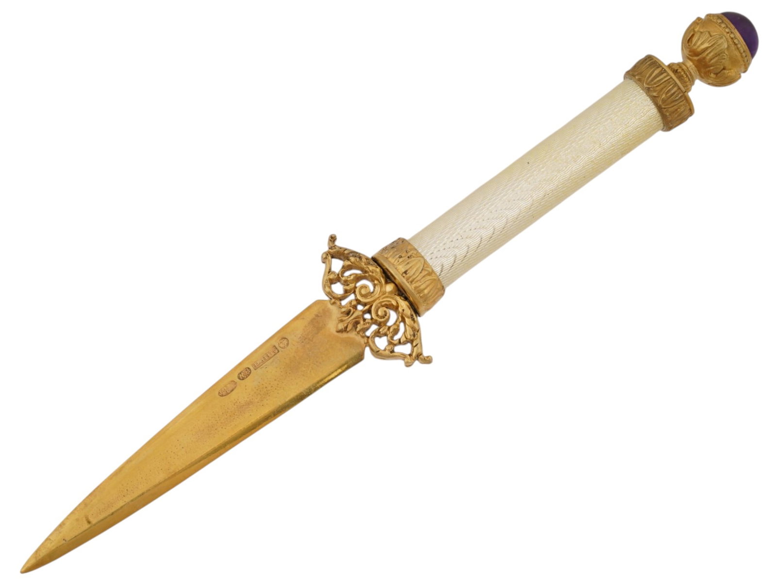 RUSSIAN SILVER ENAMEL LETTER OPENER W AMETHYST: A Russian letter opener with a gilt silver blade decorated with openwork floral decor on the ricasso. The handle is covered with white enamel over a wavy guilloche ground. The top is set with a large 