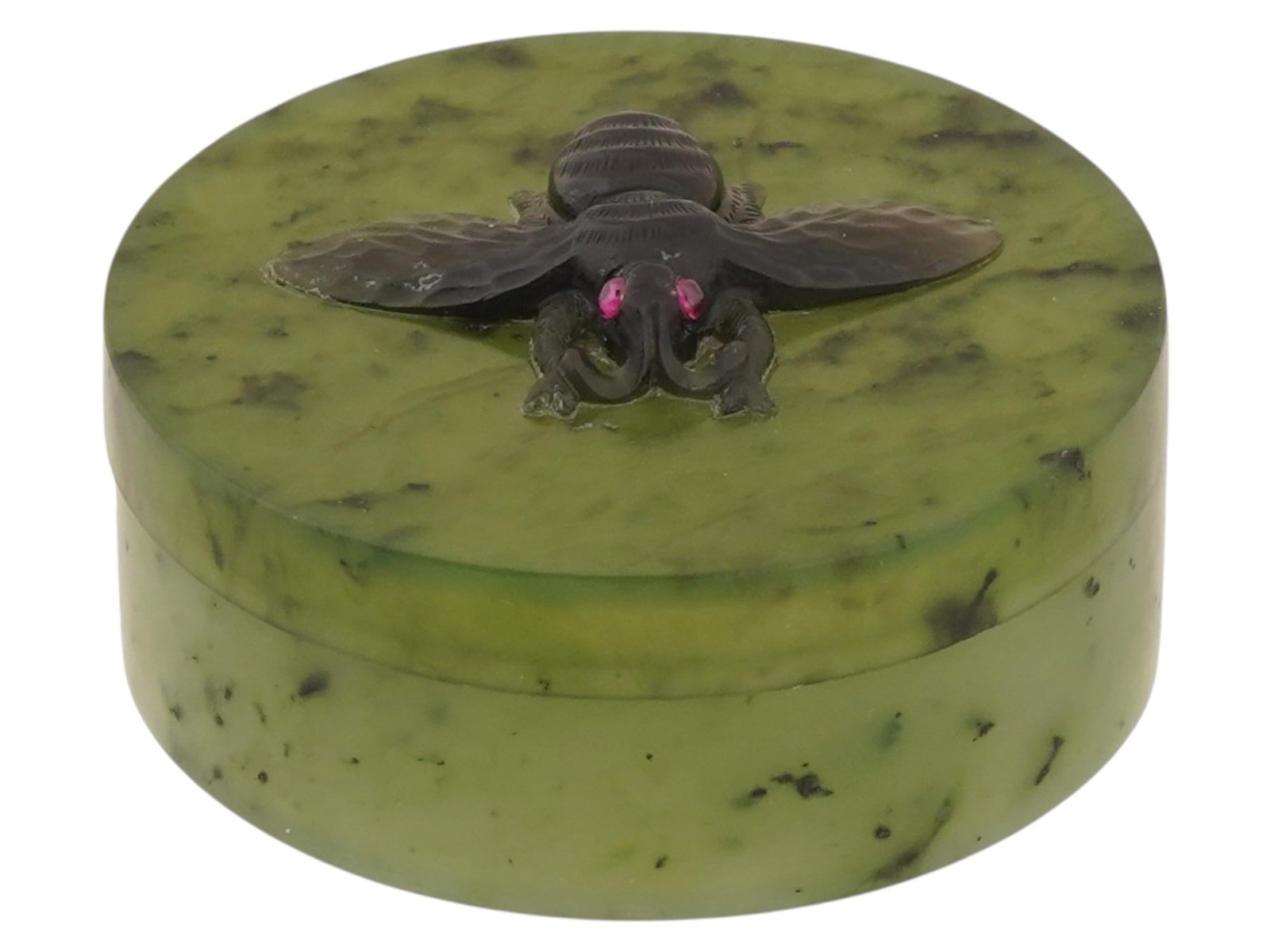RUSSIAN CARVED NEPHRITE JADE FLY BOX WITH RUBY: A Russian covered hand carved nephrite jade box featuring a detailed carved black fly perched on the top of the removable lid. The fly is encrusted with Ruby stone eyes. Russian Carved Boxes And Home 