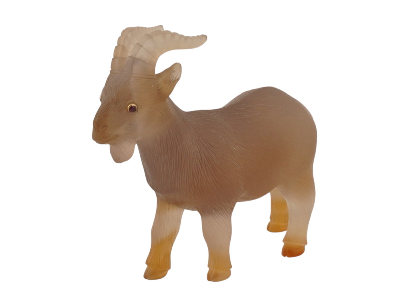 RUSSIAN CARVED AGATE FIGURINE OF A GOAT W RUBY EYES: A Russian carved agate figurine of a goat. Ruby cabochon eyes in gold fittings. Fine texture details. Total Weight: 53.1 grams. Collectible Russian Jewelry And Decor. THIS LOT IS ELIGIBLE FOR A