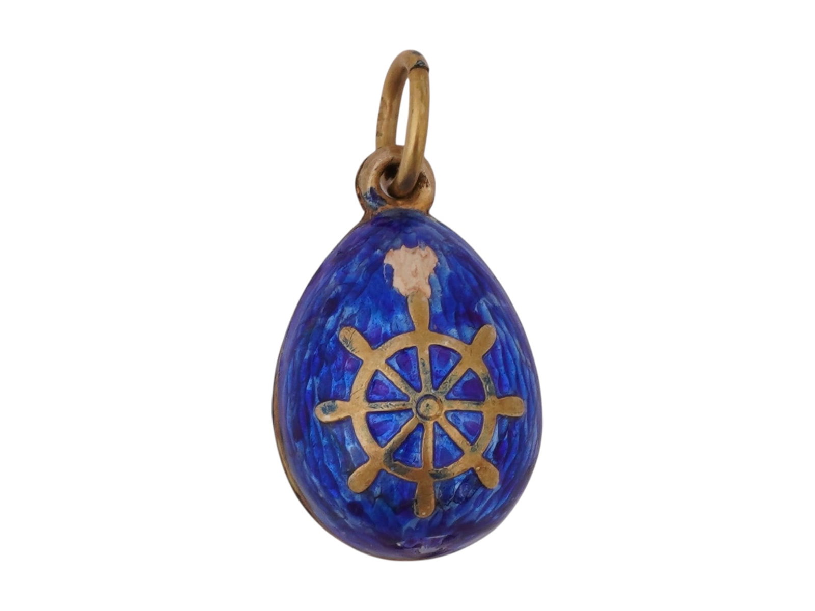 RUSSIAN GILT SILVER GUILLOCHE ENAMEL EGG PENDANT: A Russian gilt silver Easter Egg pendant. Cobalt blue guilloche enamel surface with anchor and steering wheel motifs. Hallmark of 84 silver standard and makers mark are on the fitting ring. Total