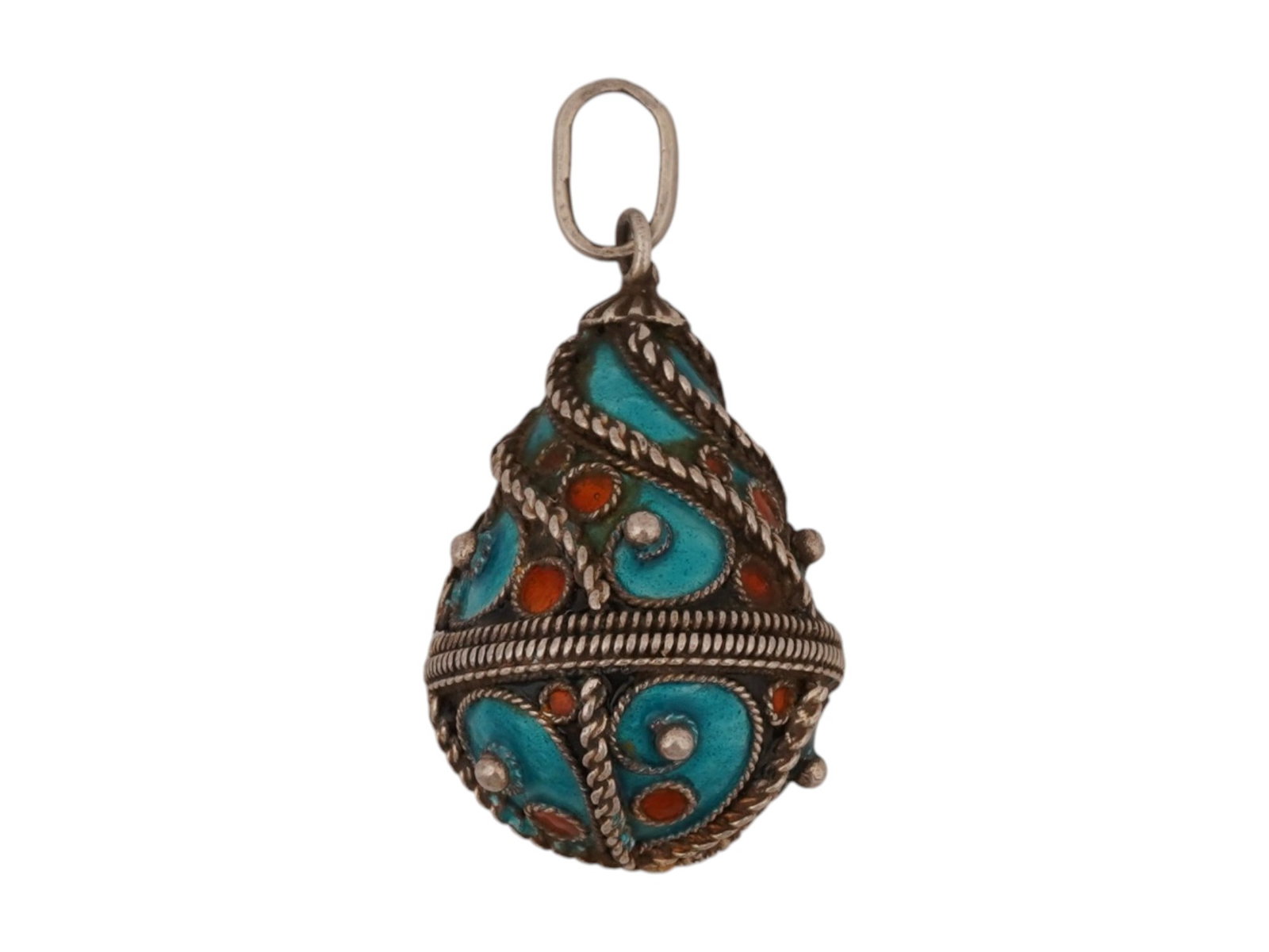 RUSSIAN SILVER FILIGREE ENAMEL EASTER EGG PENDANT: A Russian silver Easter Egg pendant. Elaborate filigree design with red and blue enamel accents. Hallmark of 84 silver standard and makers mark are on the fitting ring. Total Weight: 4 grams. Russian