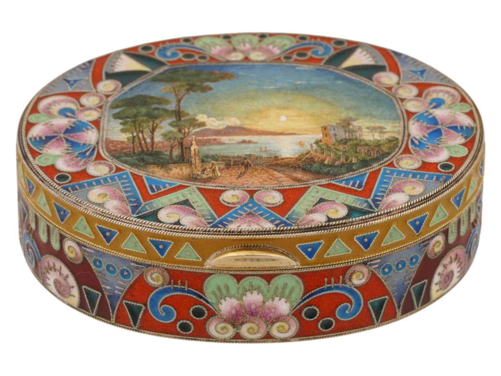 RUSSIAN GILT SILVER CLOISONNE ENAMEL TRINKET BOX: A Russian oval shaped gilt silver trinket box with a hinged lid. Polychrome floral and geometric cloisonne enamel design. The lid is garnished with a miniature painting, seascape view of Naples with