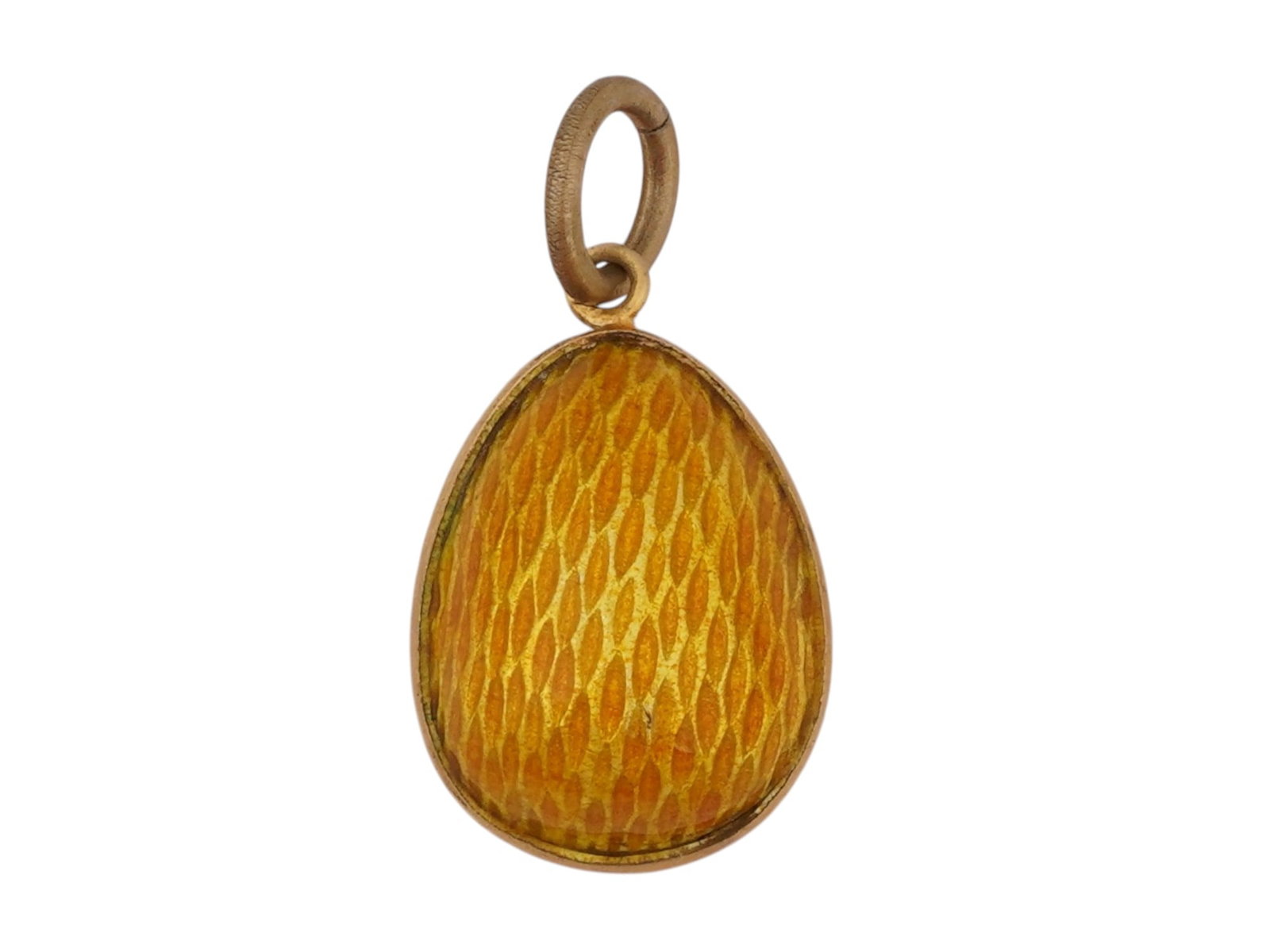 RUSSIAN SILVER GUILLOCHE ENAMEL EASTER EGG PENDANT: A Russian silver and enamel Easter egg pendant. The surface of the pendant is covered with orange guilloche enamel. Hallmarked on the fitting ring with the 84 Russian silver standard and a makers