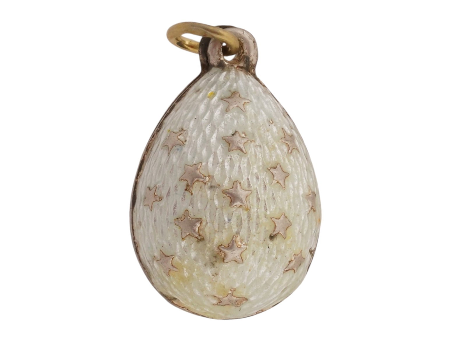RUSSIAN SILVER GUILLOCHE ENAMEL EASTER EGG PENDANT: A Russian 84 gilt Silver and enamel Easter egg pendant. The exterior of the egg is covered with Guilloche enamel in blue and white shades and adorned with a relief design depicting stars. Marked with