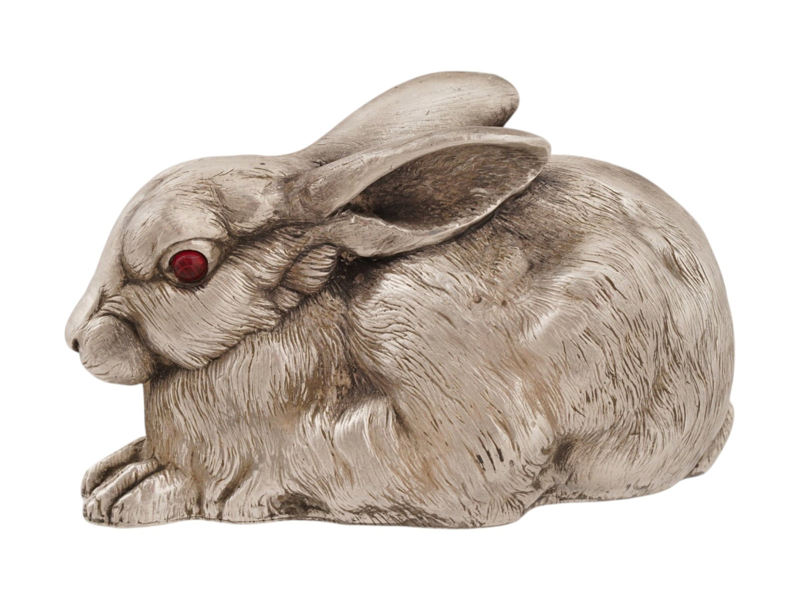 RUSSIAN 84 SILVER RABBIT FIGURINE W GEMSTONE EYES: A large Russian silver figure naturalistically cast in the form of a rabbit. The figurine is well modeled, the surface texture is worked out with a chisel. The eyes are inlaid with two red cabochon cu