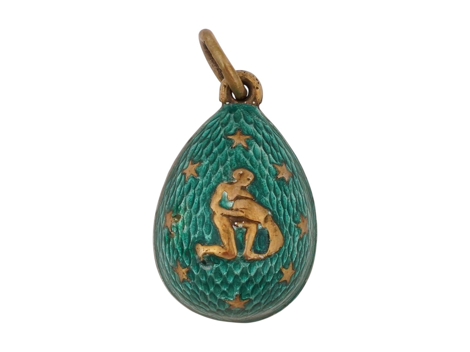 RUSSIAN GILT SILVER GUILLOCHE ENAMEL EASTER EGG PENDANT: A Russian gilt silver Easter Egg pendant. Green guilloche enamel surface. Aquarius zodiac sign and stars motifs on both sides. Hallmarked with an 84 Russian silver standard and makers mark on the