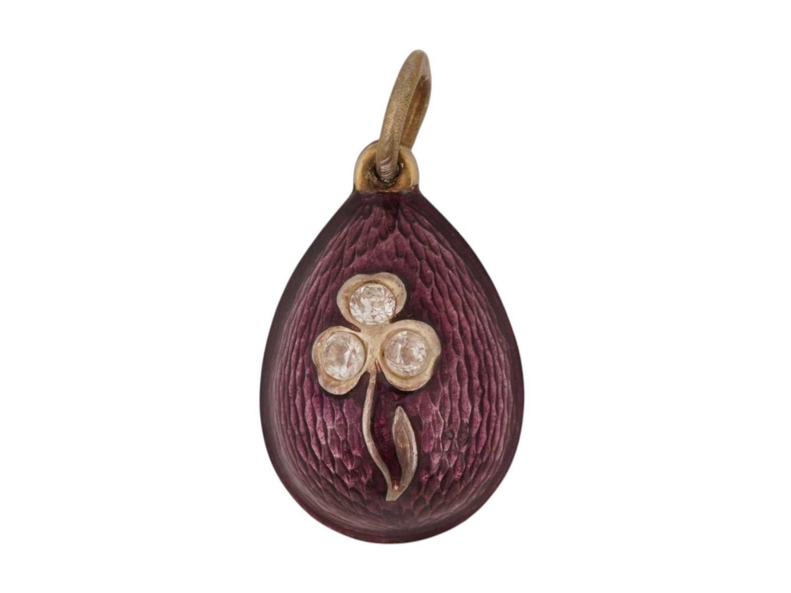 RUSSIAN SILVER GUILLOCHE ENAMEL GEMS EASTER EGG PENDANT: A Russian gilt silver Easter Egg pendant. Purple guilloche enamel surface with floral motif on the obverse, set with gemstones. Hallmark of 88 silver standard and makers mark are on the fitting ring.
