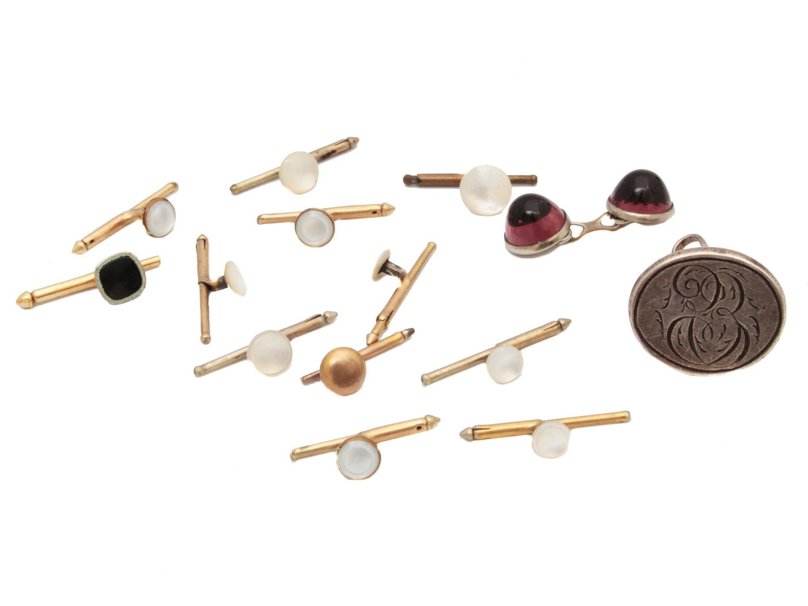 A FINE SET OF 14 VINTAGE CUFFLINKS: This collection includes a vintage swank gold-toned cufflinks, a swank shirt silver stud, weight 6 g., among others. Circa early 20th century. THIS LOT IS ELIGIBLE FOR A 30-DAY UNCONDITIONAL RETURN