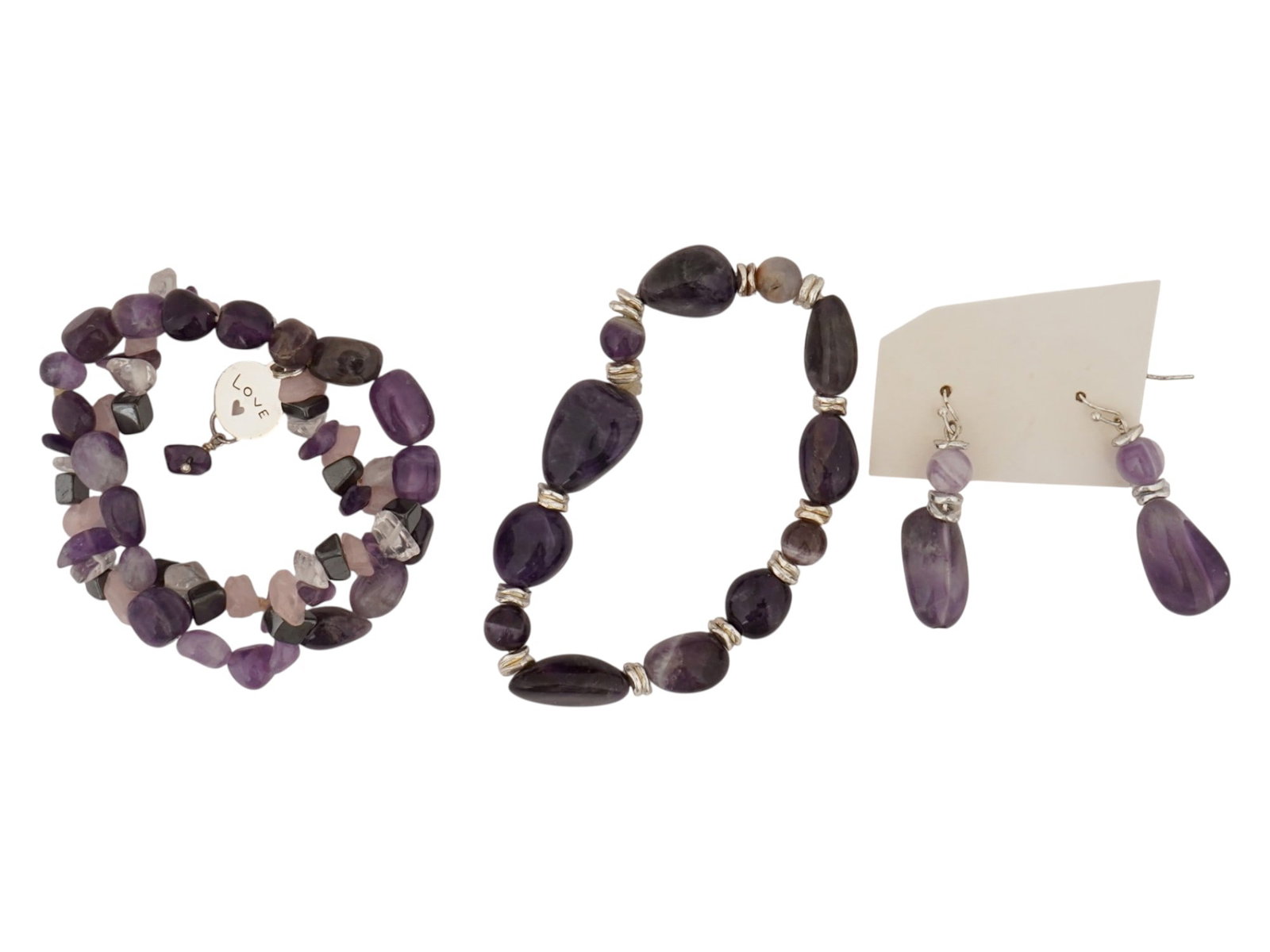 VINTAGE COSTUME JEWELRY STONE BRACELETS AND EARRINGS: A lot of vintage costume jewelry bracelets and earrings made of stones. The lot includes a multi-layer and single-layer bracelet made of stones of various shapes and sizes, as well as a pair of