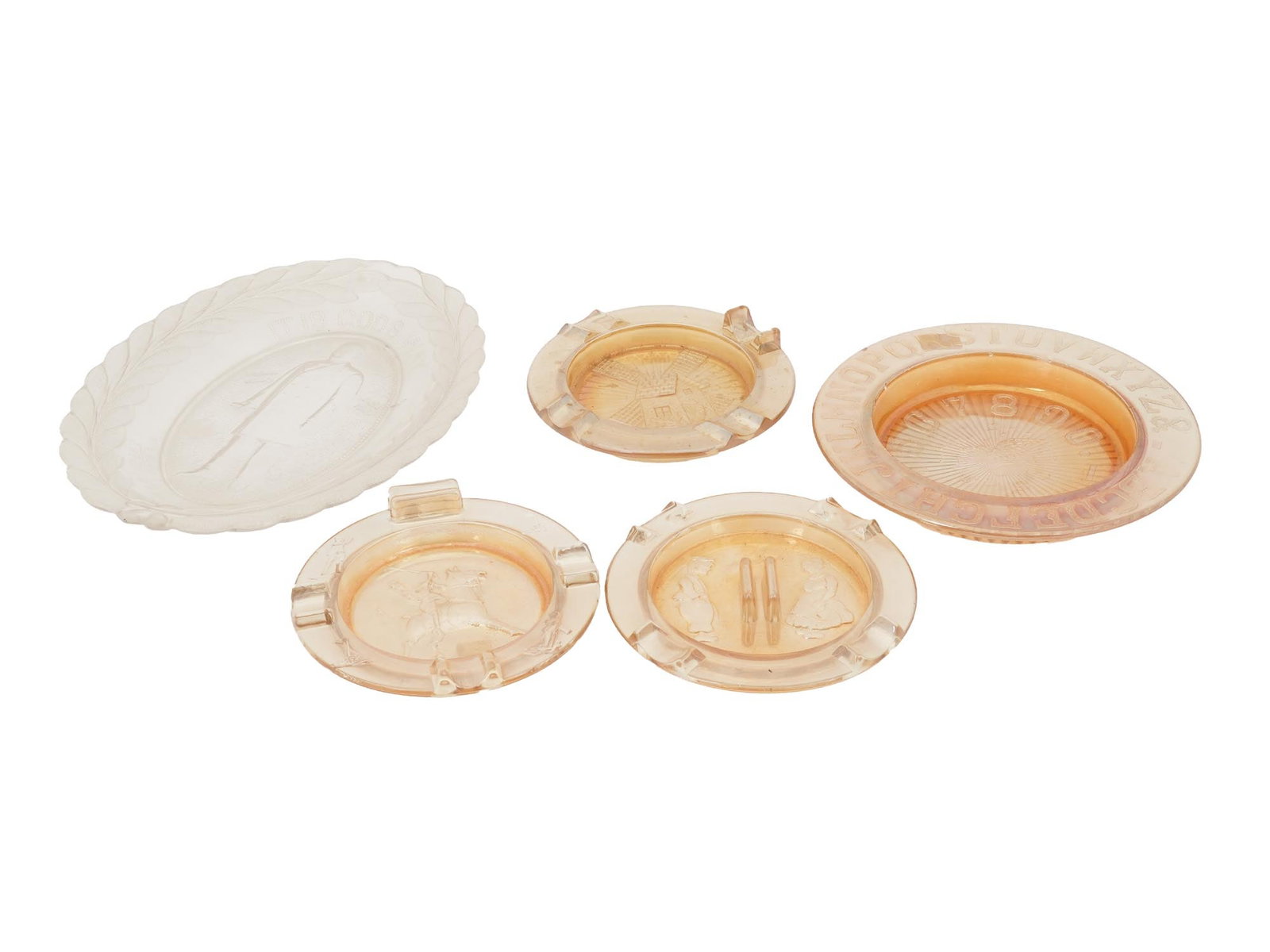 EARLY AMERICAN PRESSED GLASS PLATES AND ASHTRAYS: A lot of antique American pressed glassware dating back to the early 20th century. It was low cost at the time but has been highly collectible since the 1960s. A total of five items. An oval clear gla