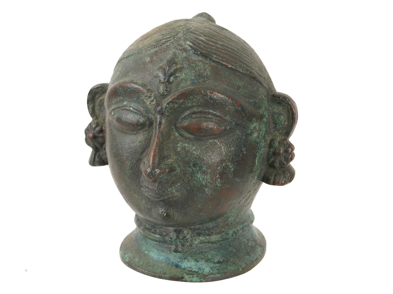 VINTAGE SOUTH INDIAN BRONZE HEAD OF GAURI: A vintage South Indian cast bronze sculpture, female head representing Gauri, one of the appearances of Parvati, the principal goddess of Hinduism. Almond-shaped eyes and strict hairstyle with floral 