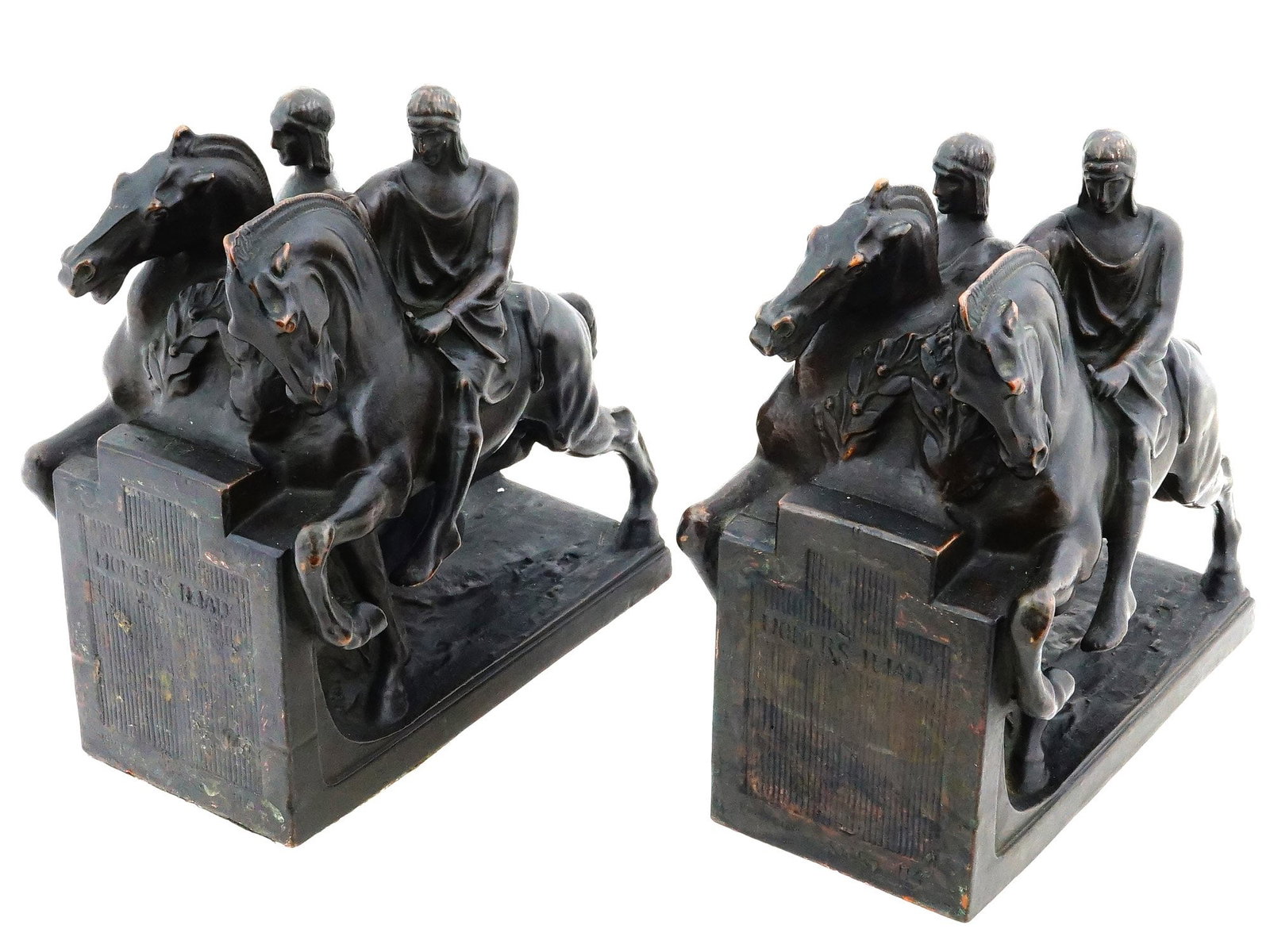 ANTIQUE POMPEIAN BRONZE COMPANY BOOKENDS HOMERS ILIAD: A pair of antique bookends produced by the Pompeian Bronze Company, circa the 1920s, featuring scenes inspired by Homers Iliad. Crafted in electroformed bronze over a substantial composition core,