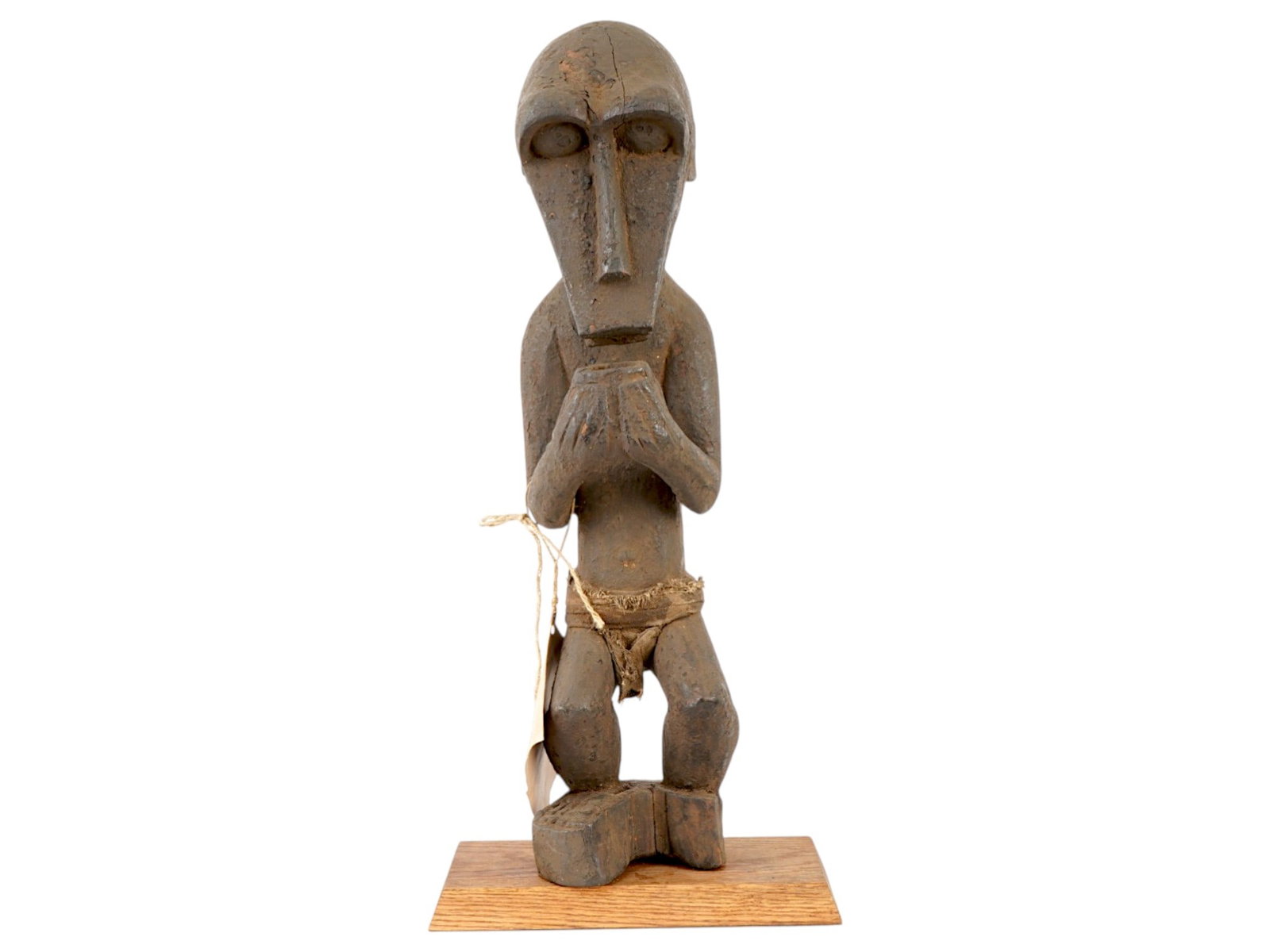 AFRICAN BOULE HAND CARVED IRON WOOD MONKEY FIGURE: An African hand carved iron wooden figure originates from the Baule people of the Ivory Coast and represents a Gbekre, or monkey effigy, associated with agricultural and protective cults. The sculptur