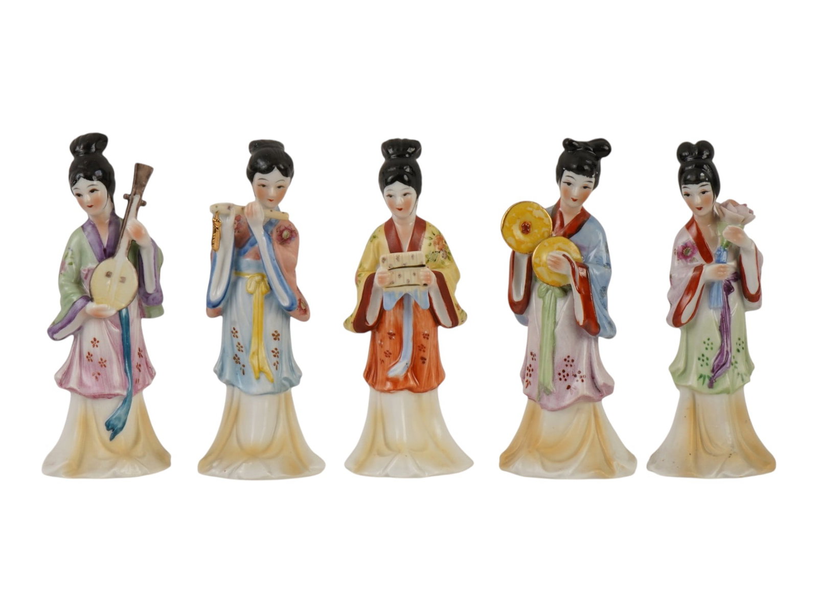 LOT OF JAPANESE FEMALE MUSICIANS PORCELAIN FIGURINES: A lot of five vintage Japanese glazed porcelain figurines. Showa era, ca. 1950s. The figures represent geishas playing traditional musical instruments. Each piece is stamped on the bottom. Collectible