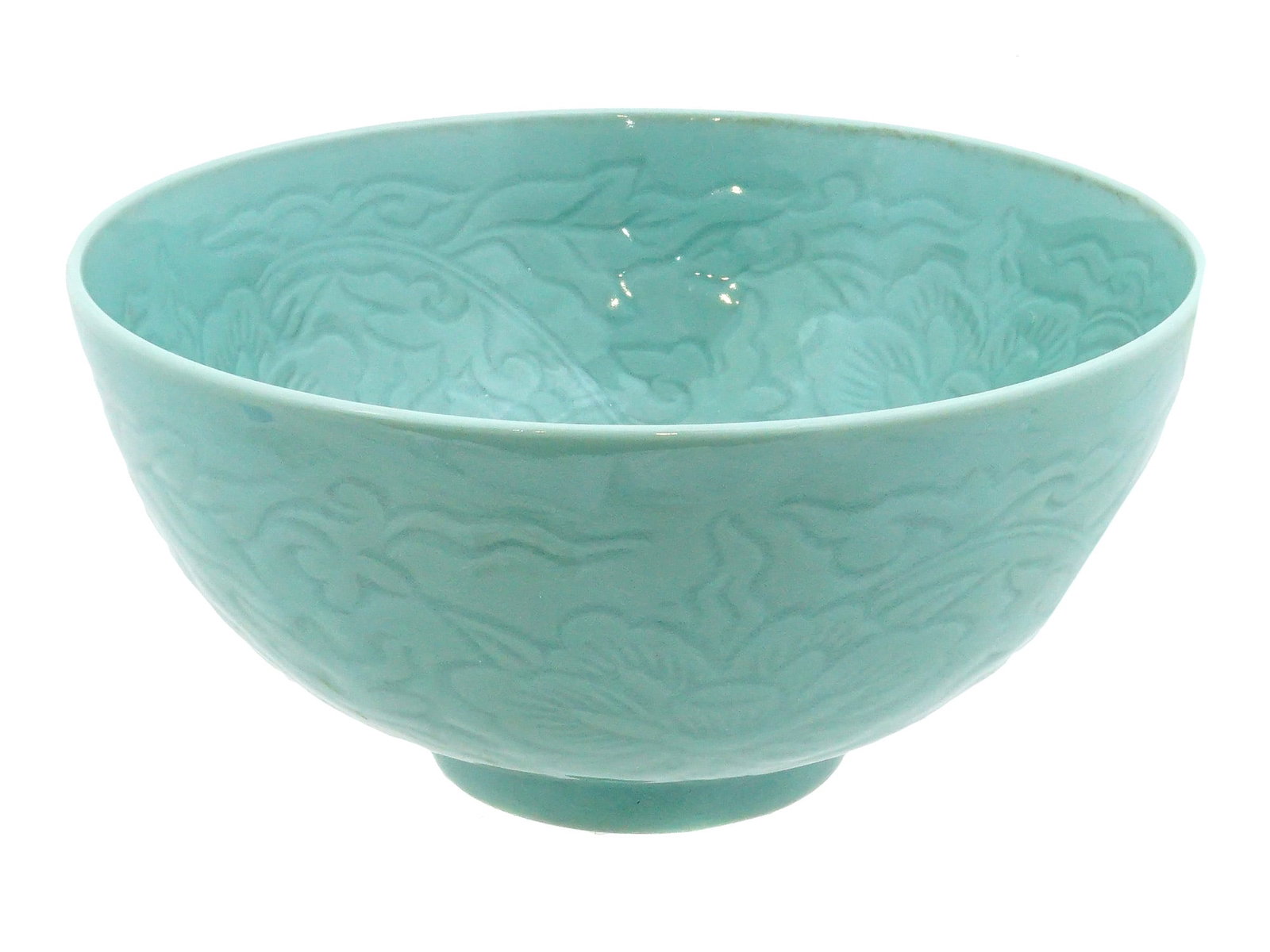 ANTIQUE CHINESE CELADON GLAZED CERAMIC BOWL: An antique Chinese celadon glazed ceramic bowl. The outer and inner surfaces are decorated with relief floral patterns with peony and foliage motifs. Collectible Desk Wares, Ceramic and Porcelain, Hom